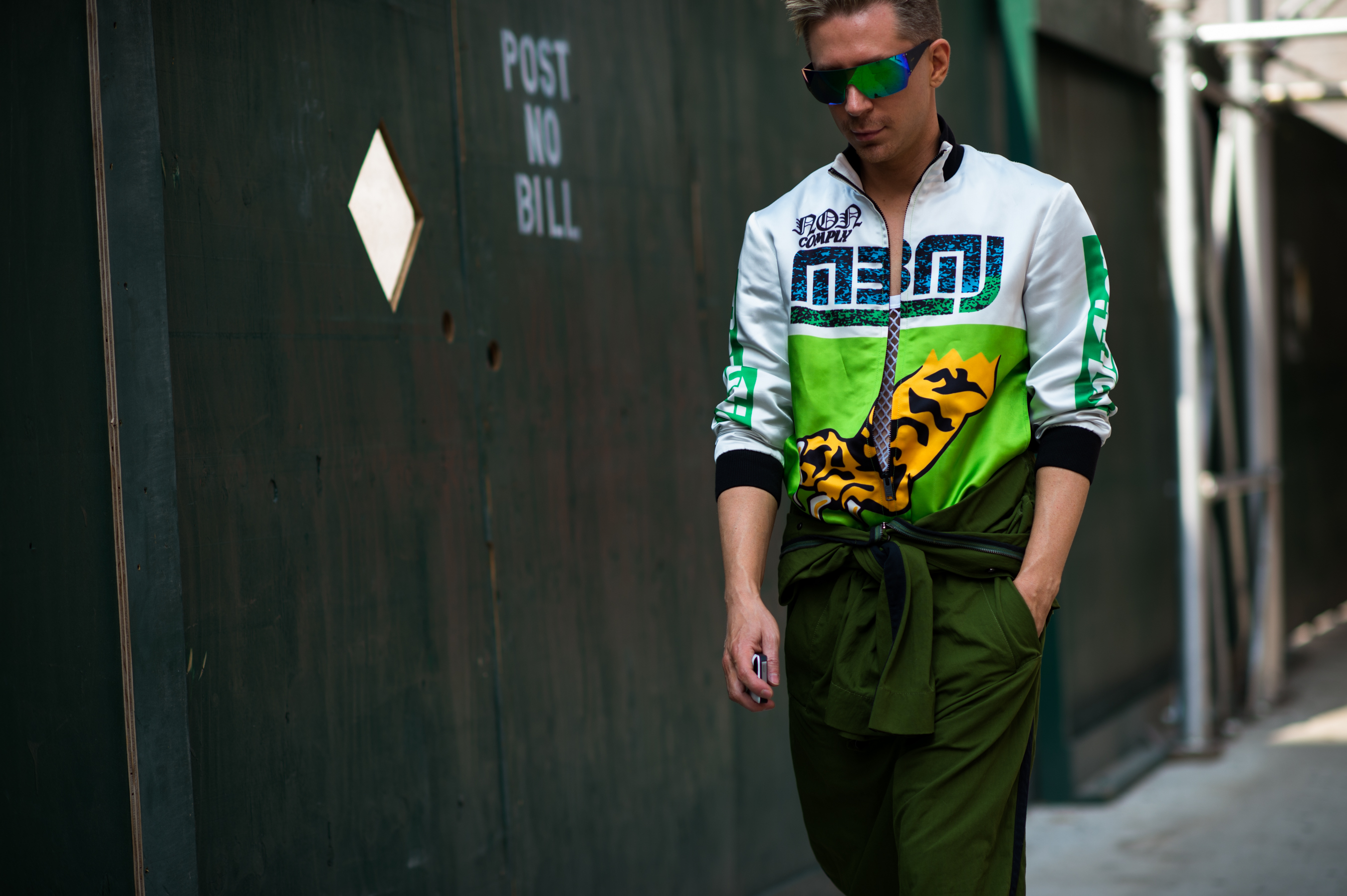 Man wearing green sport glasses