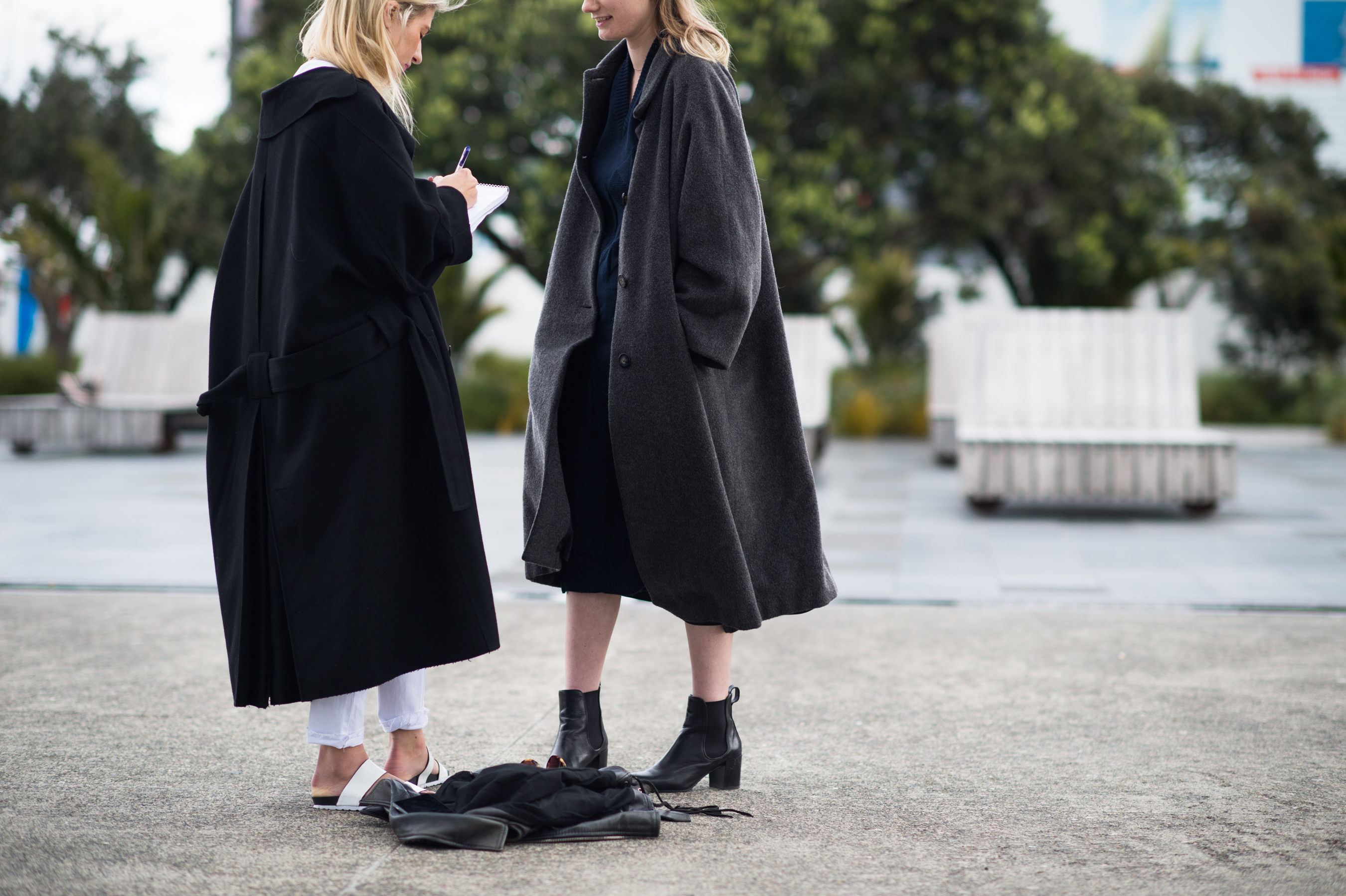 Two Kiwi girls in big coats