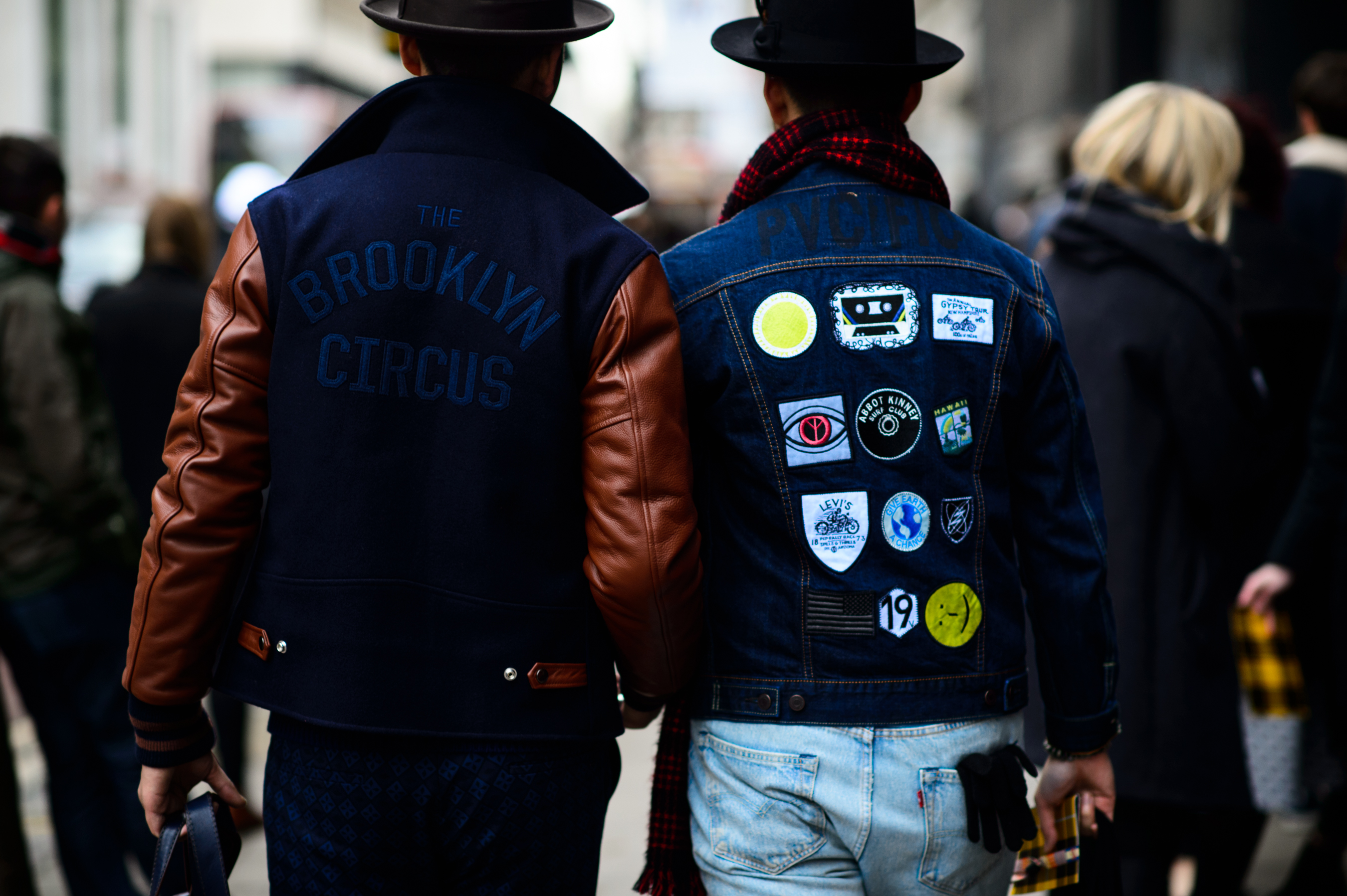 Two men wearing jackets and hats