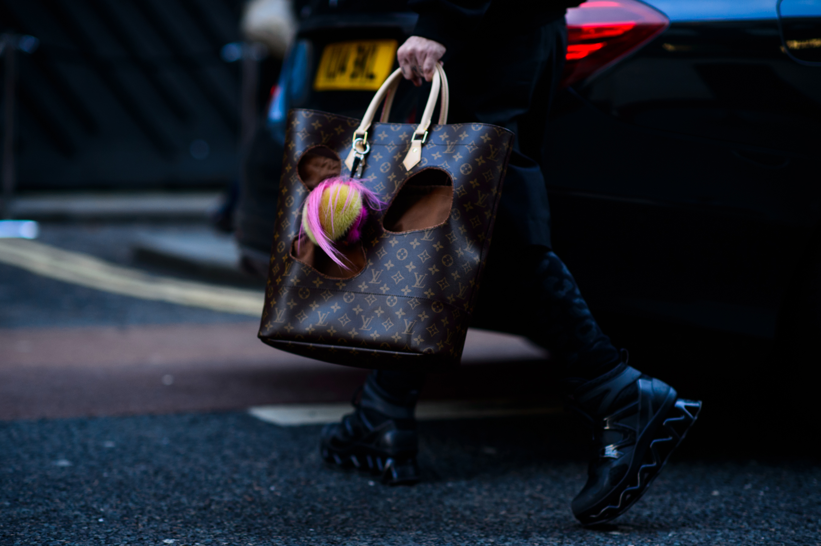 Man with a Louis Vuitton Comme des Garçons bag
