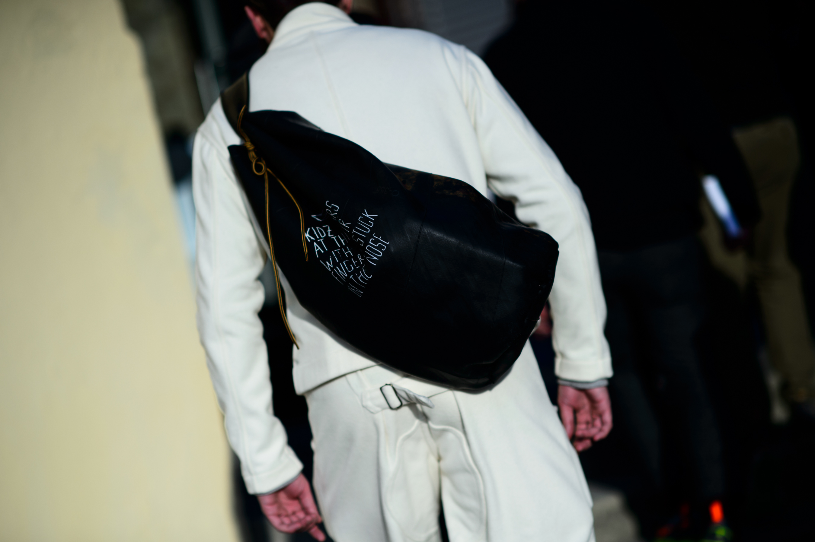 Man wearing a rubber shoulder bag
