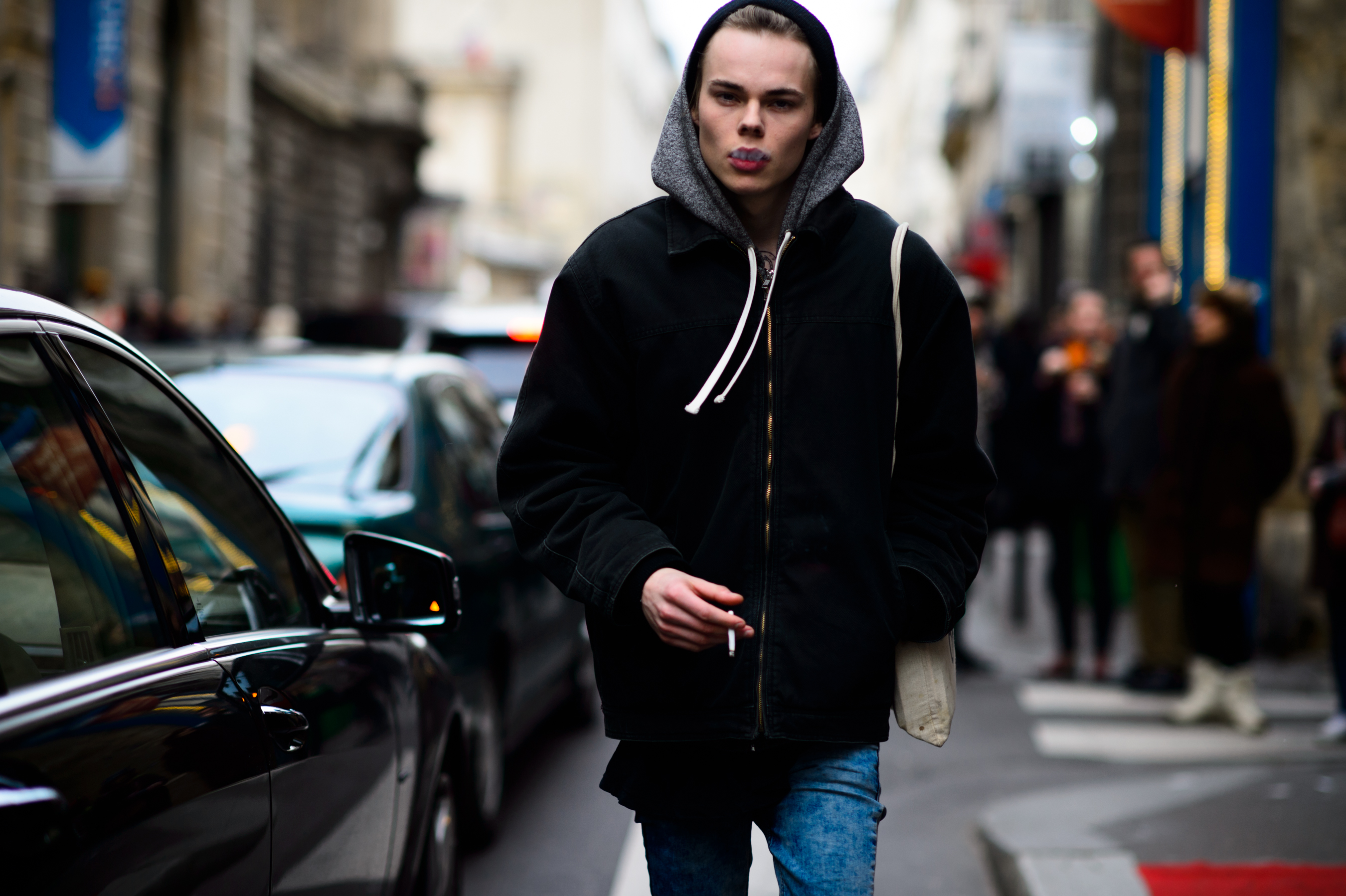 Male model smoking after a fashion show
