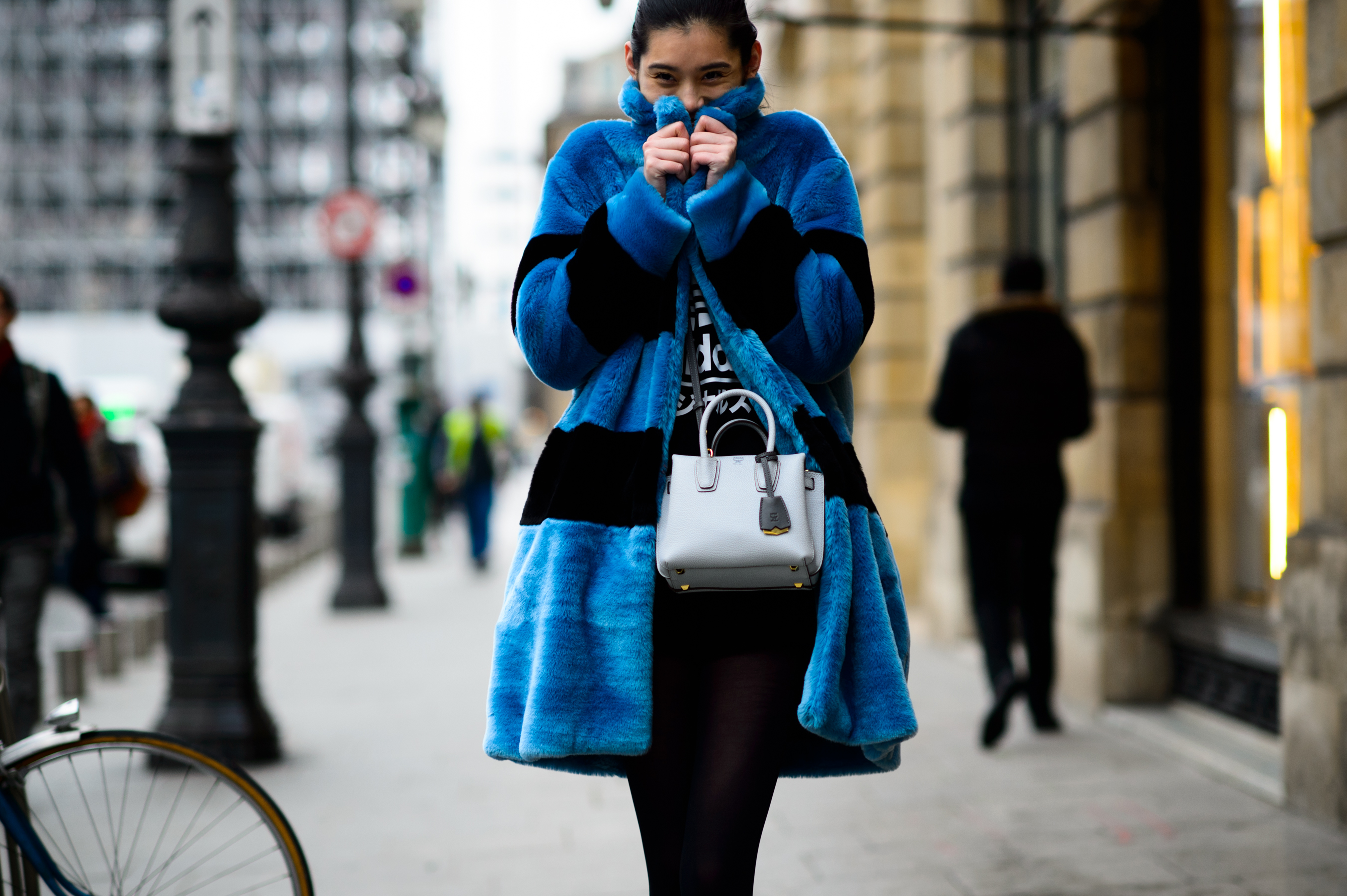 Chinese model wearing a blue fuzzy coat