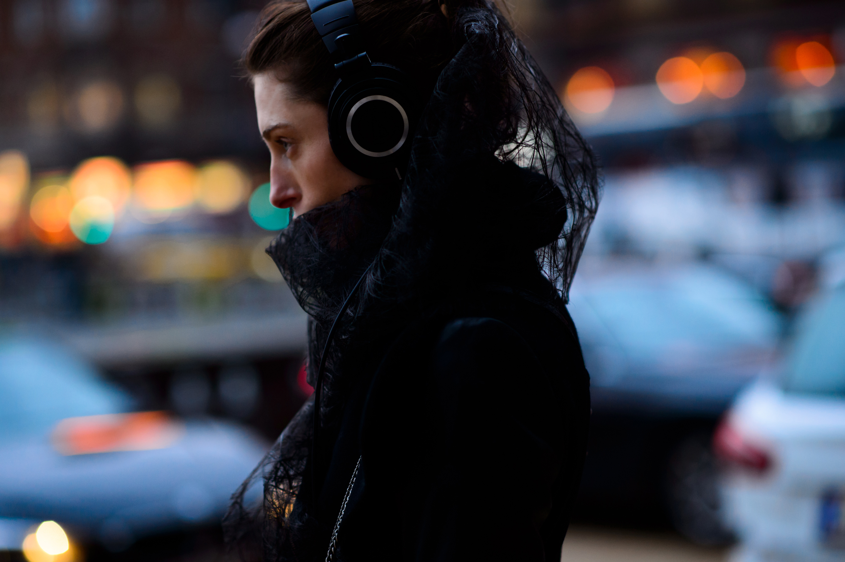Danish girl wearing headphones and a lace hood