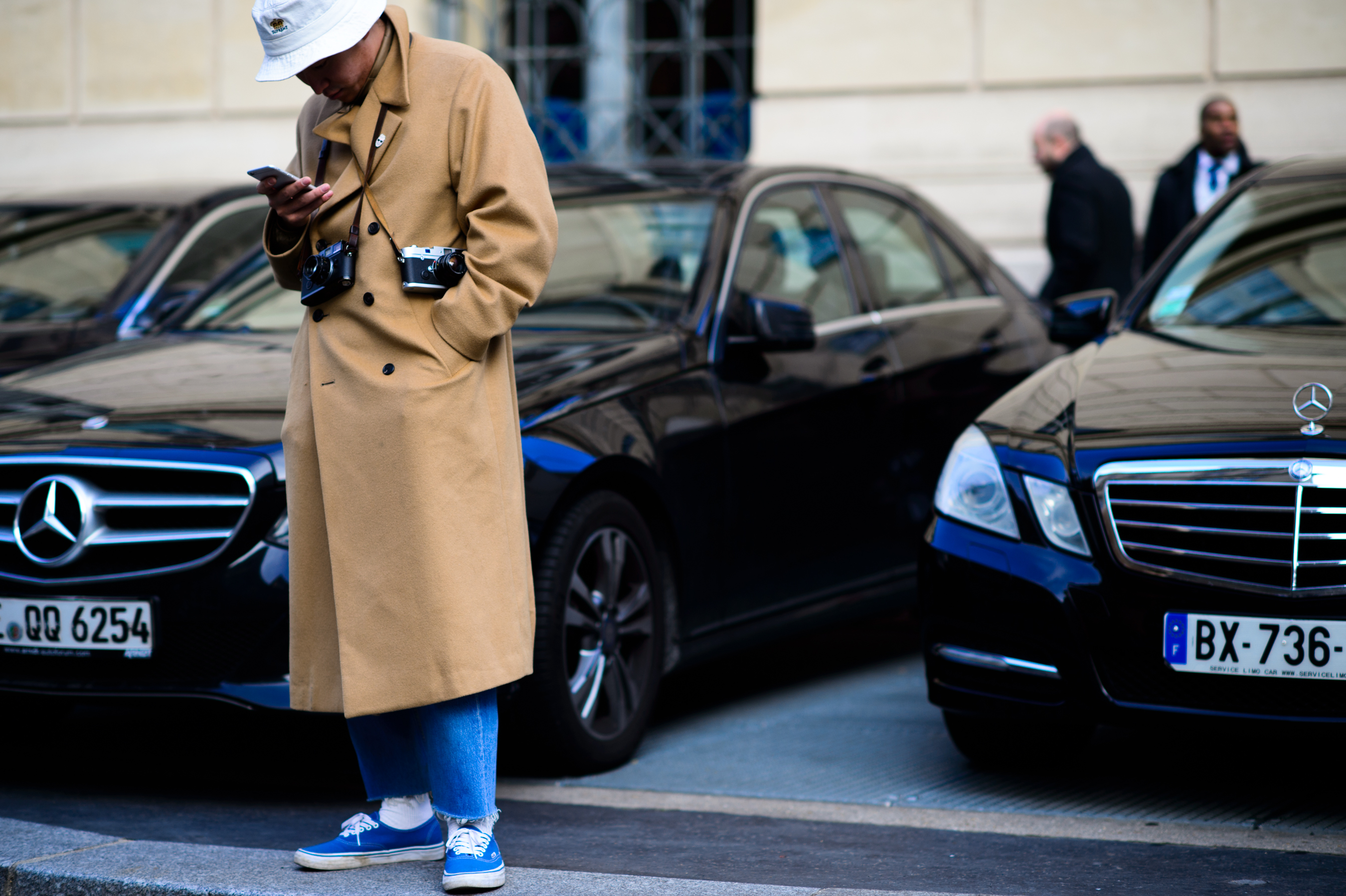 Korean photographer wearing trench coat