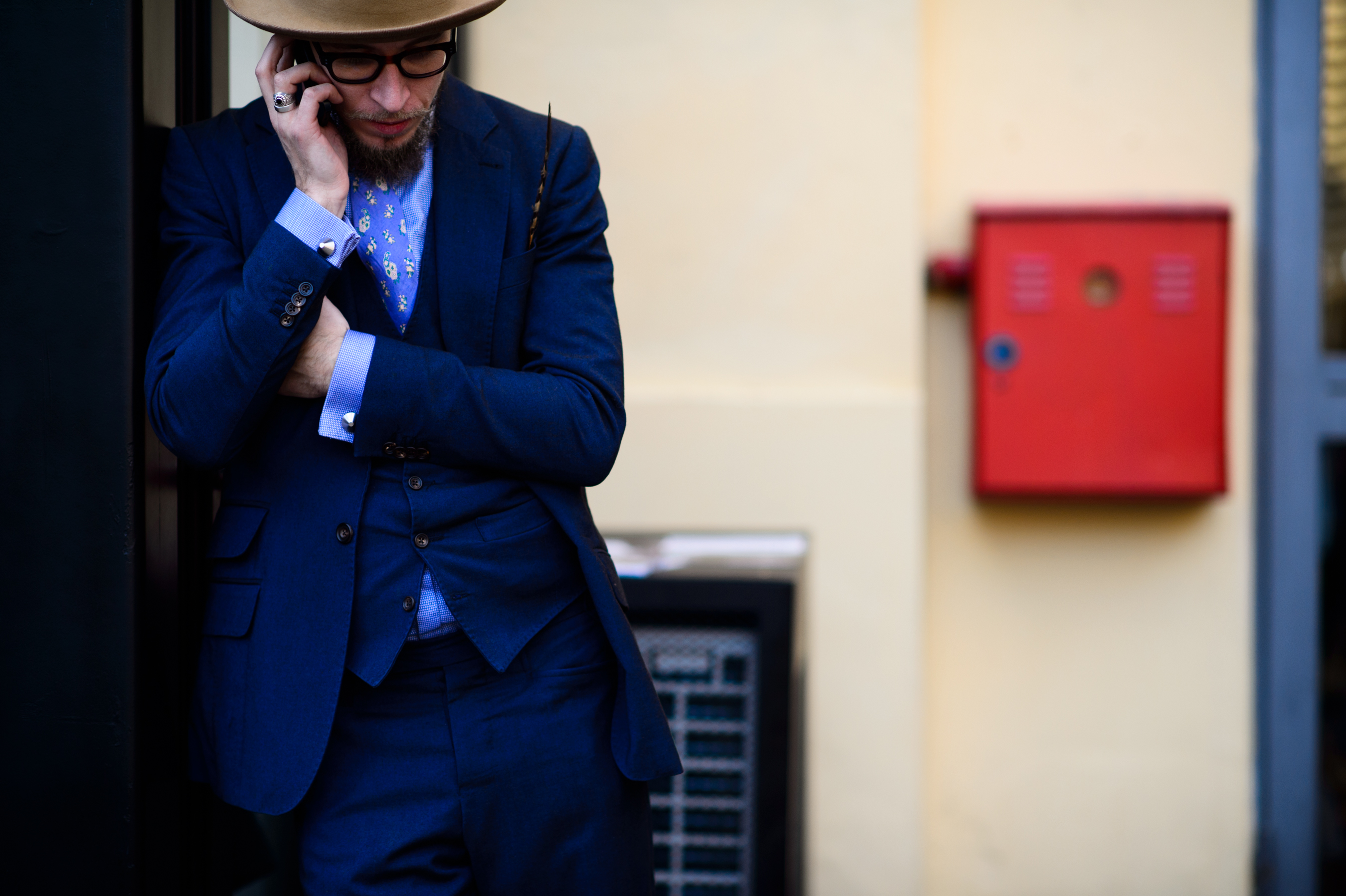 Man talking on the phone wearing Norwegian Rain