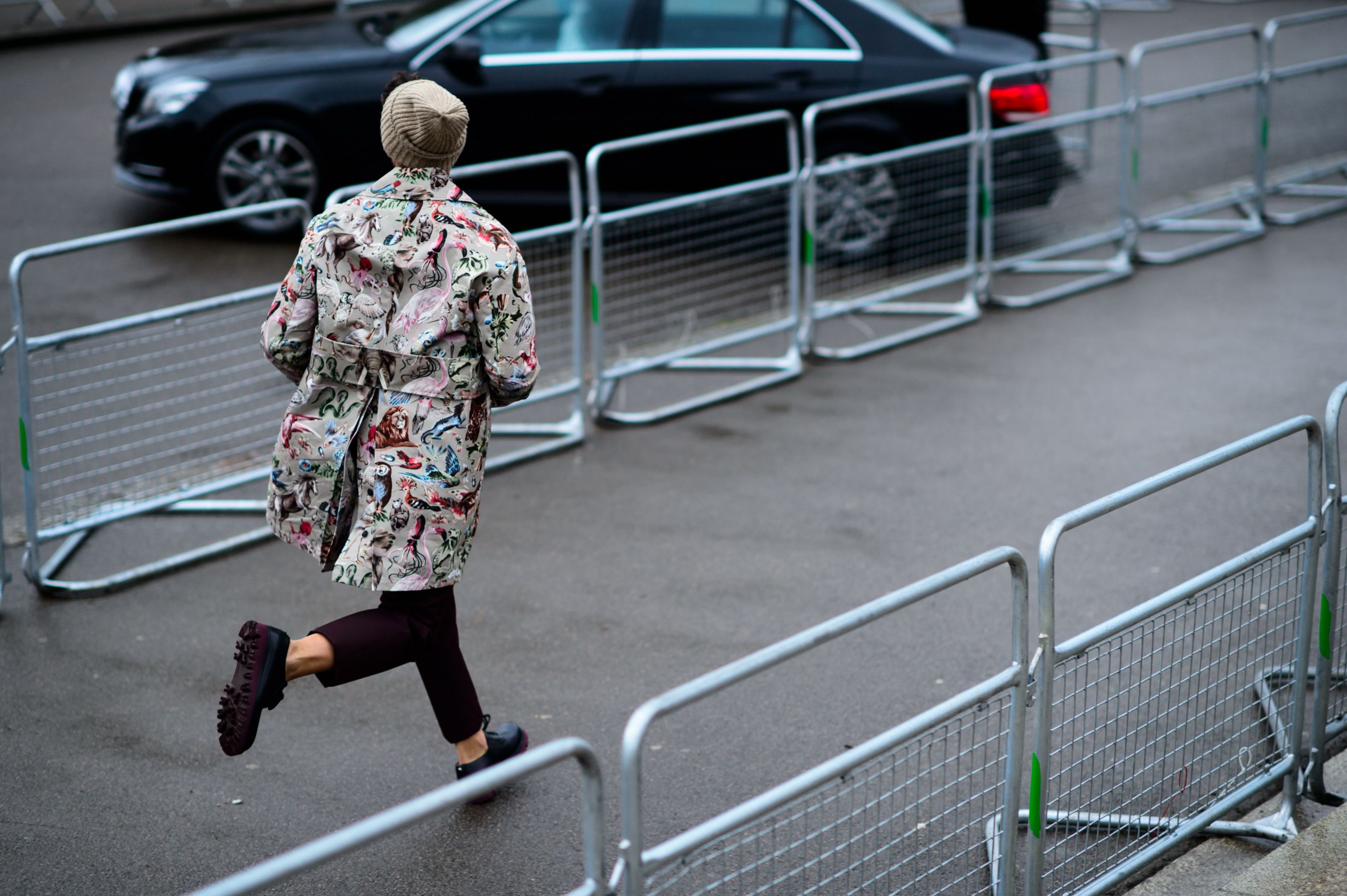 Italian man in Valentino running to a show