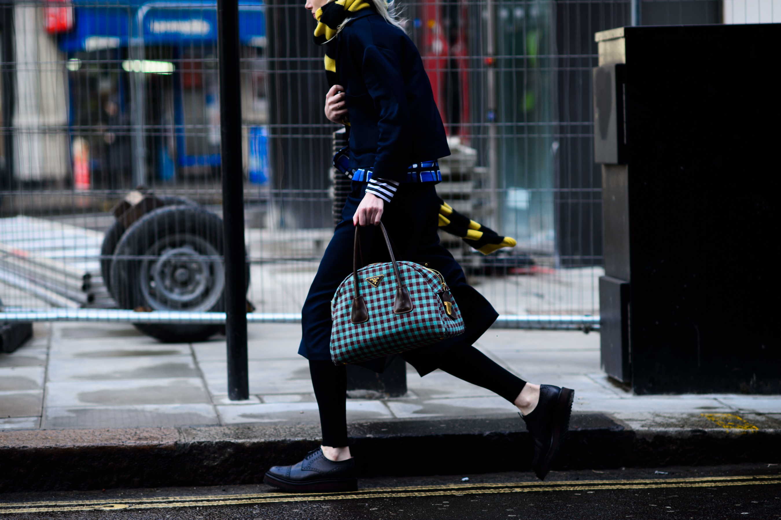 Woman rushing to a fashion show