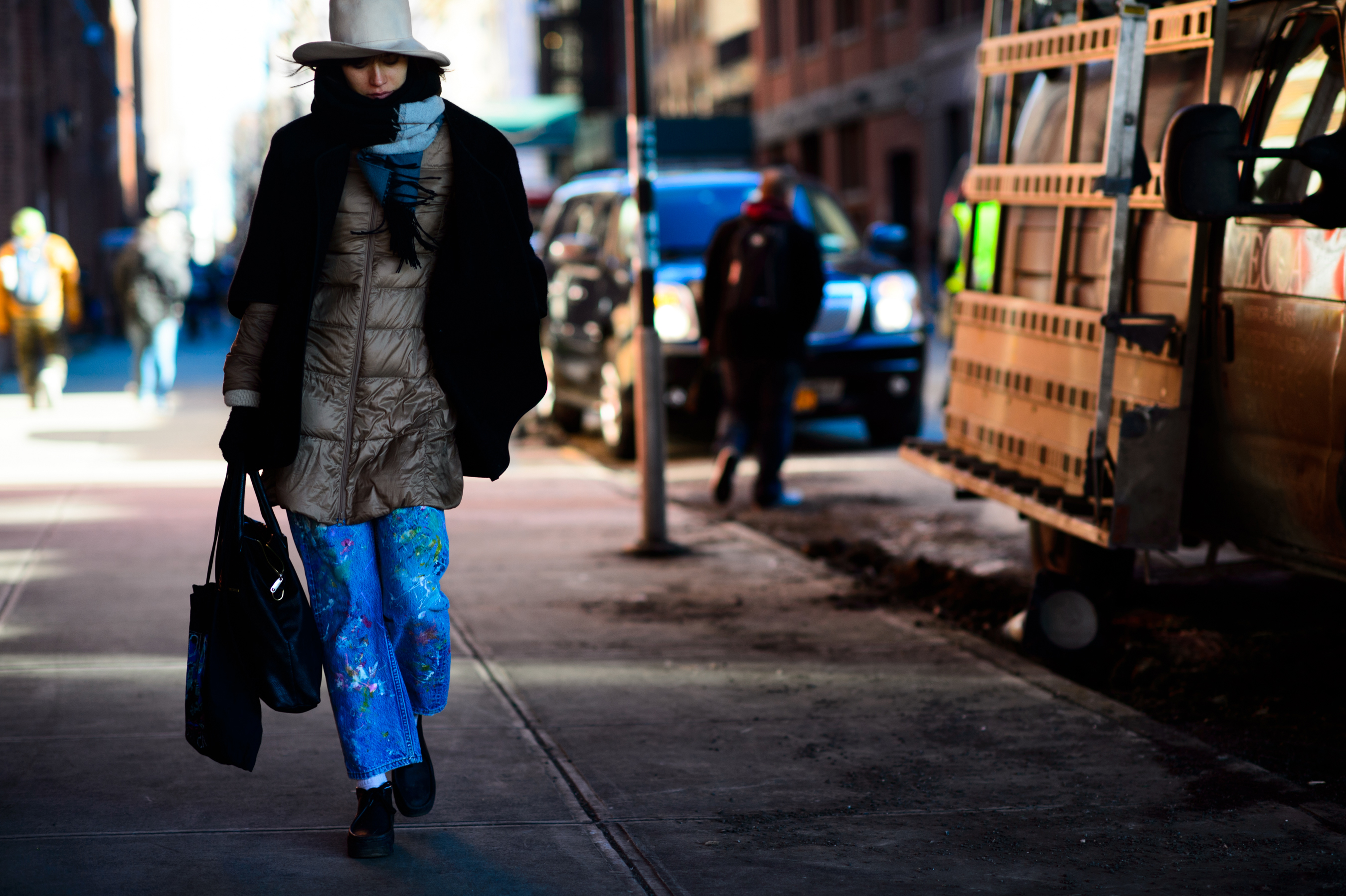 Woman with paint splattered jeans
