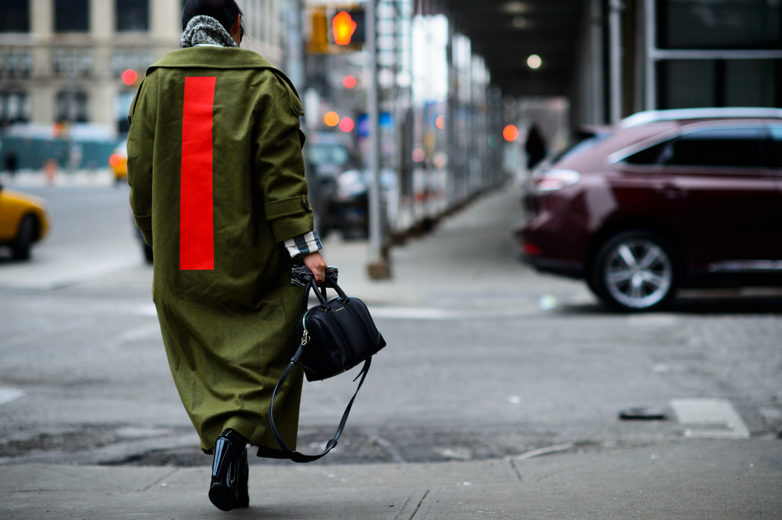 Australian blogger wearing a green and red coat