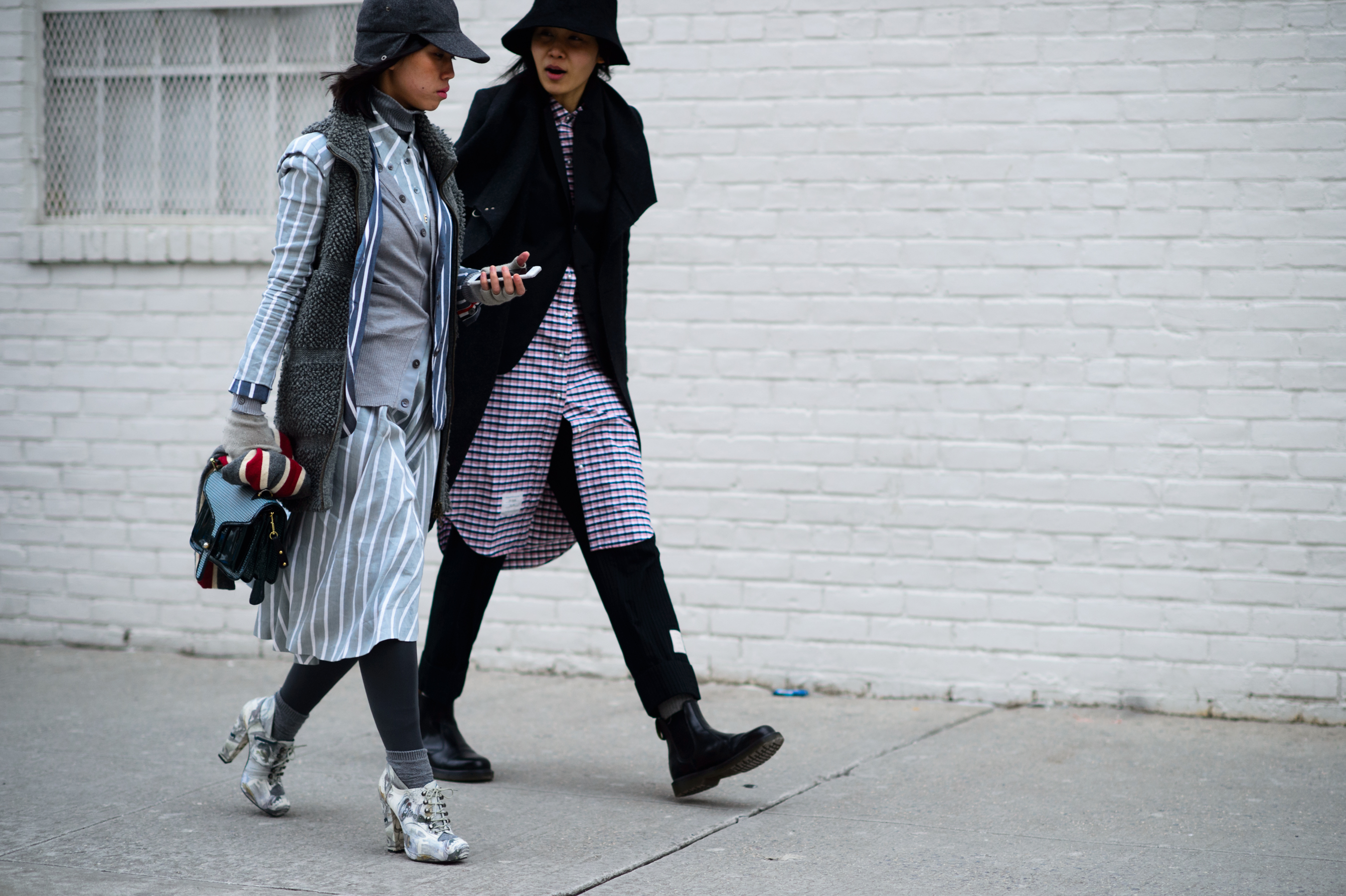 Two women wearing the designer