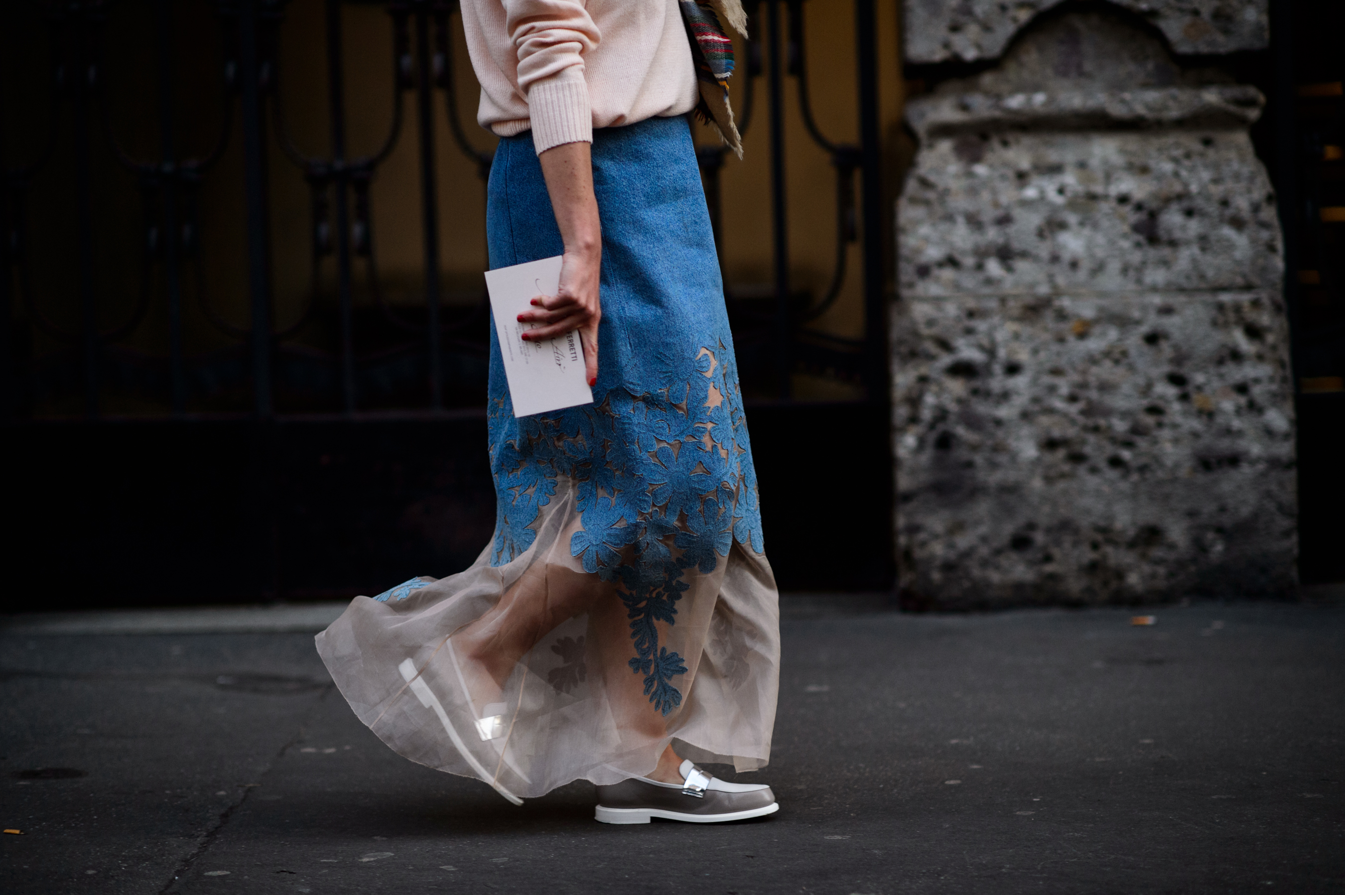 Woman wearing a denim floral skirt