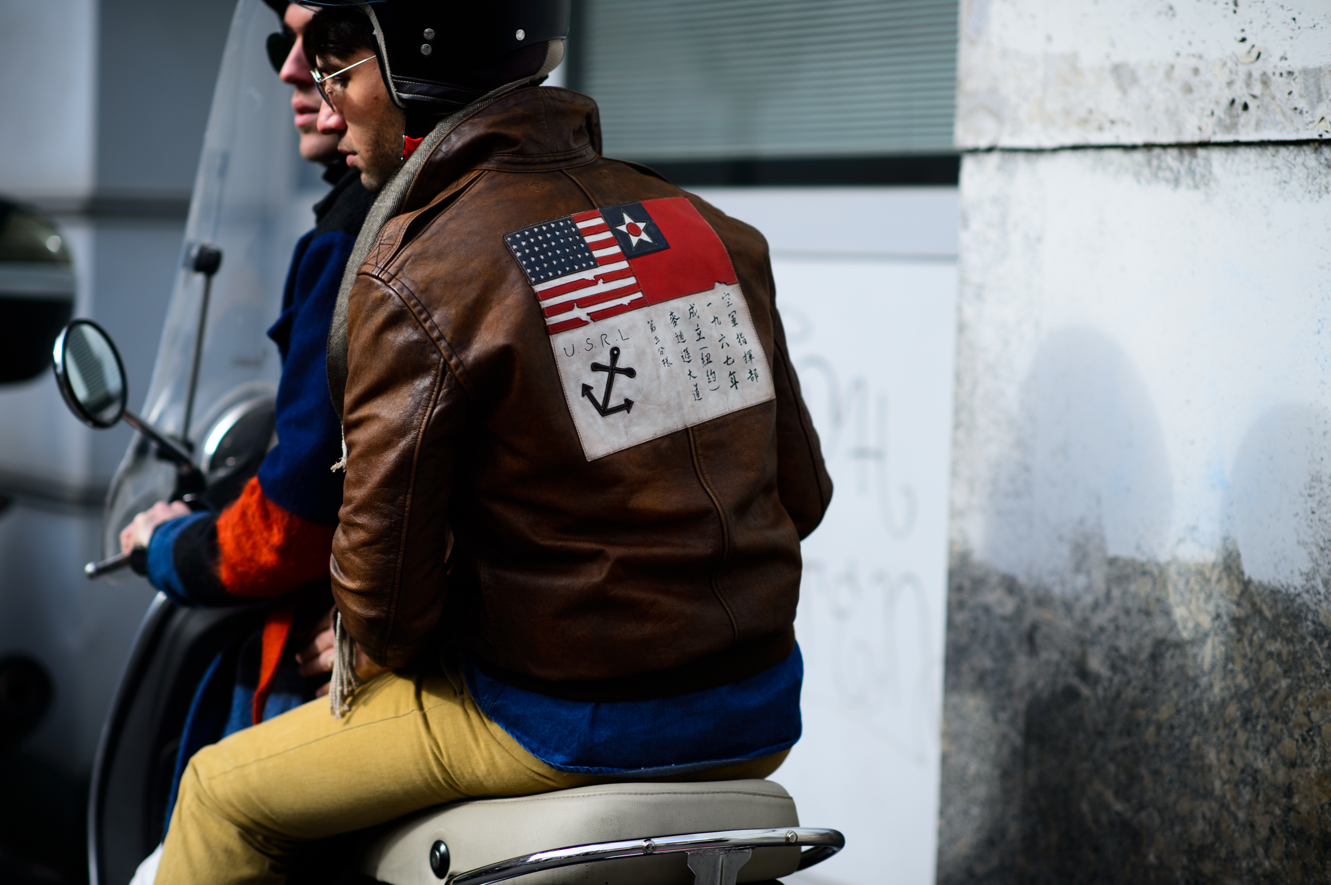 Two men on a scooter