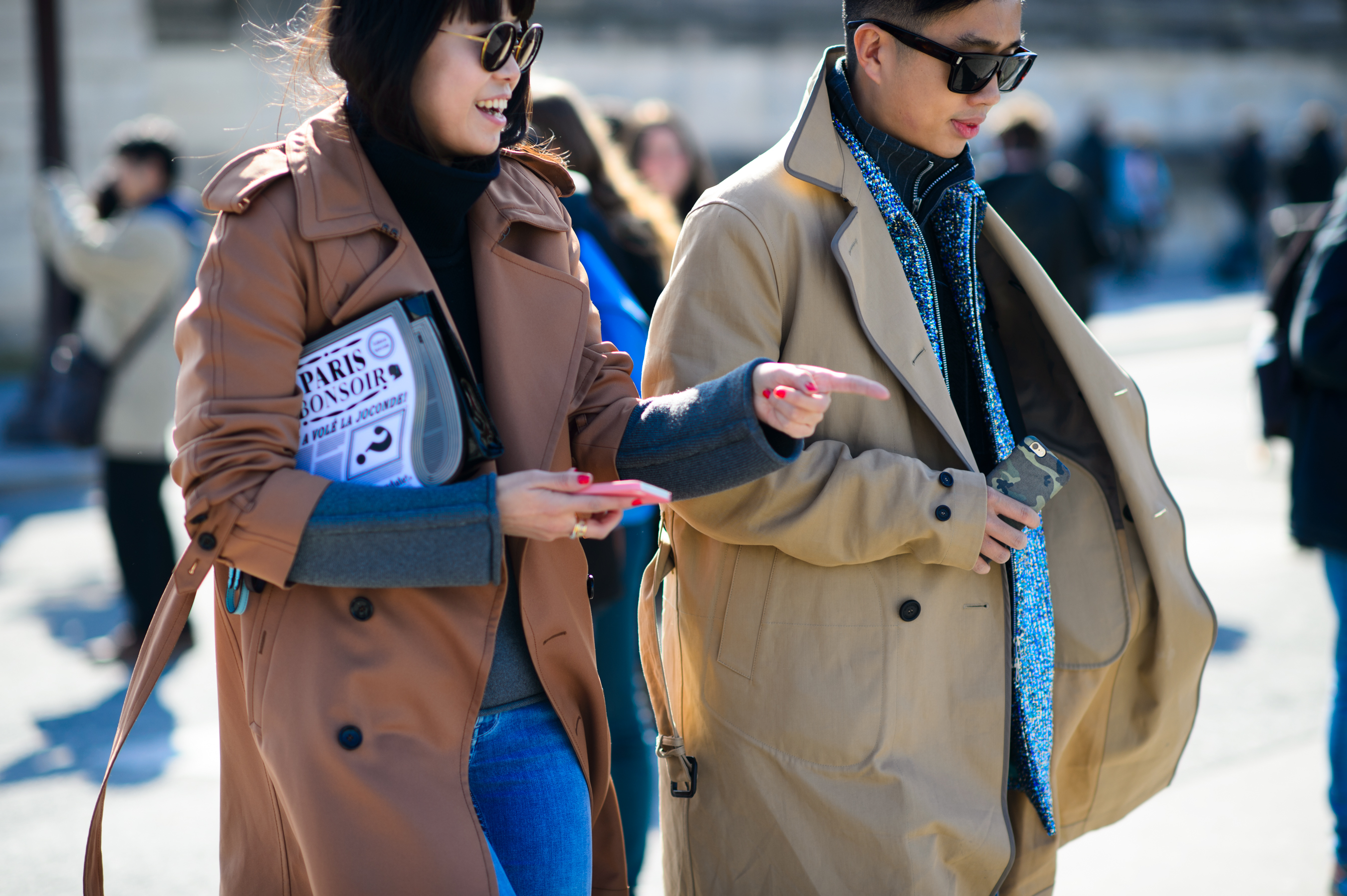 Chinese man and women wearing trenchcoats