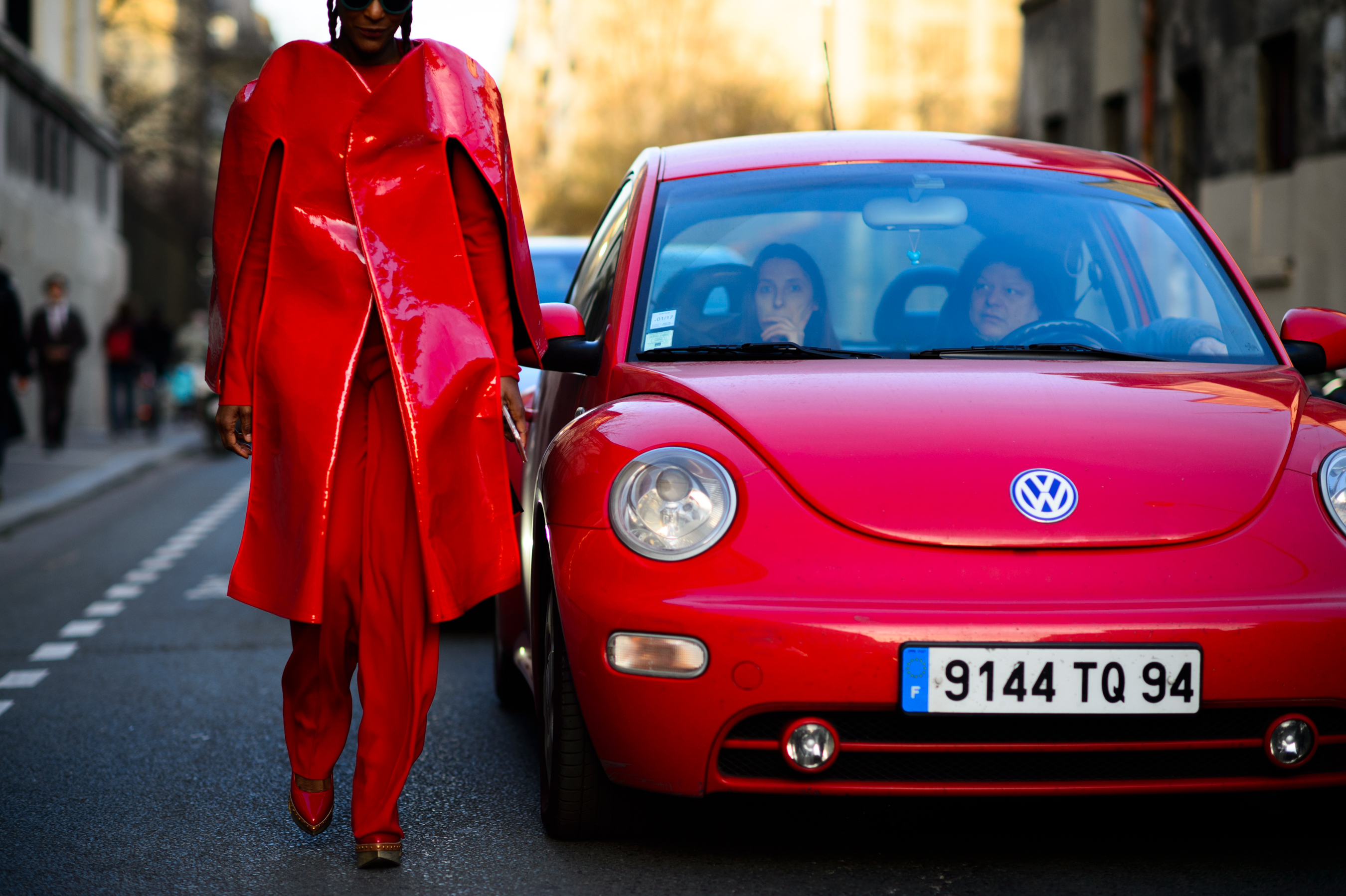 Garage magazine editor wearing red Comme des Garçons