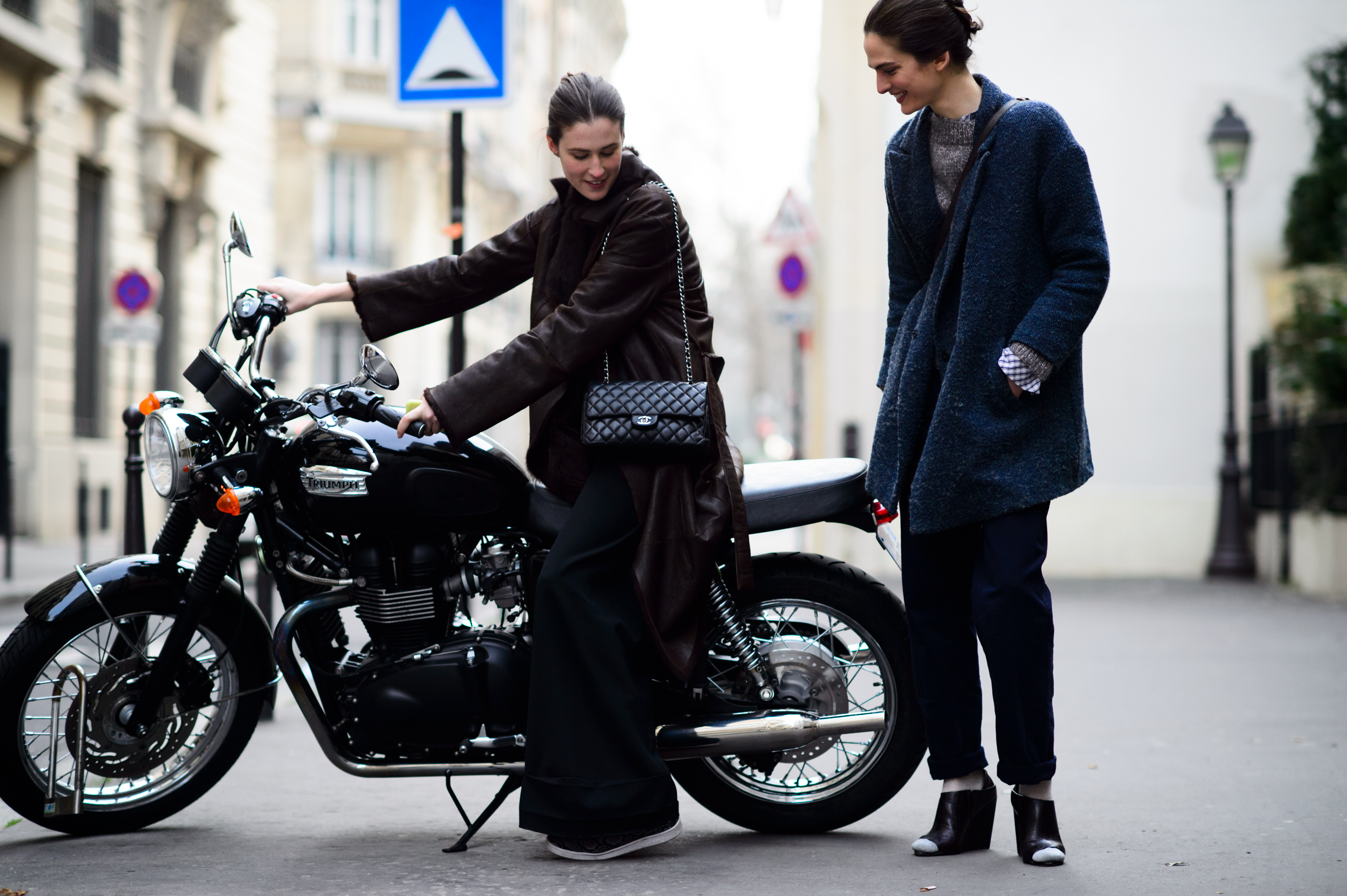 Two models on a motorcycle