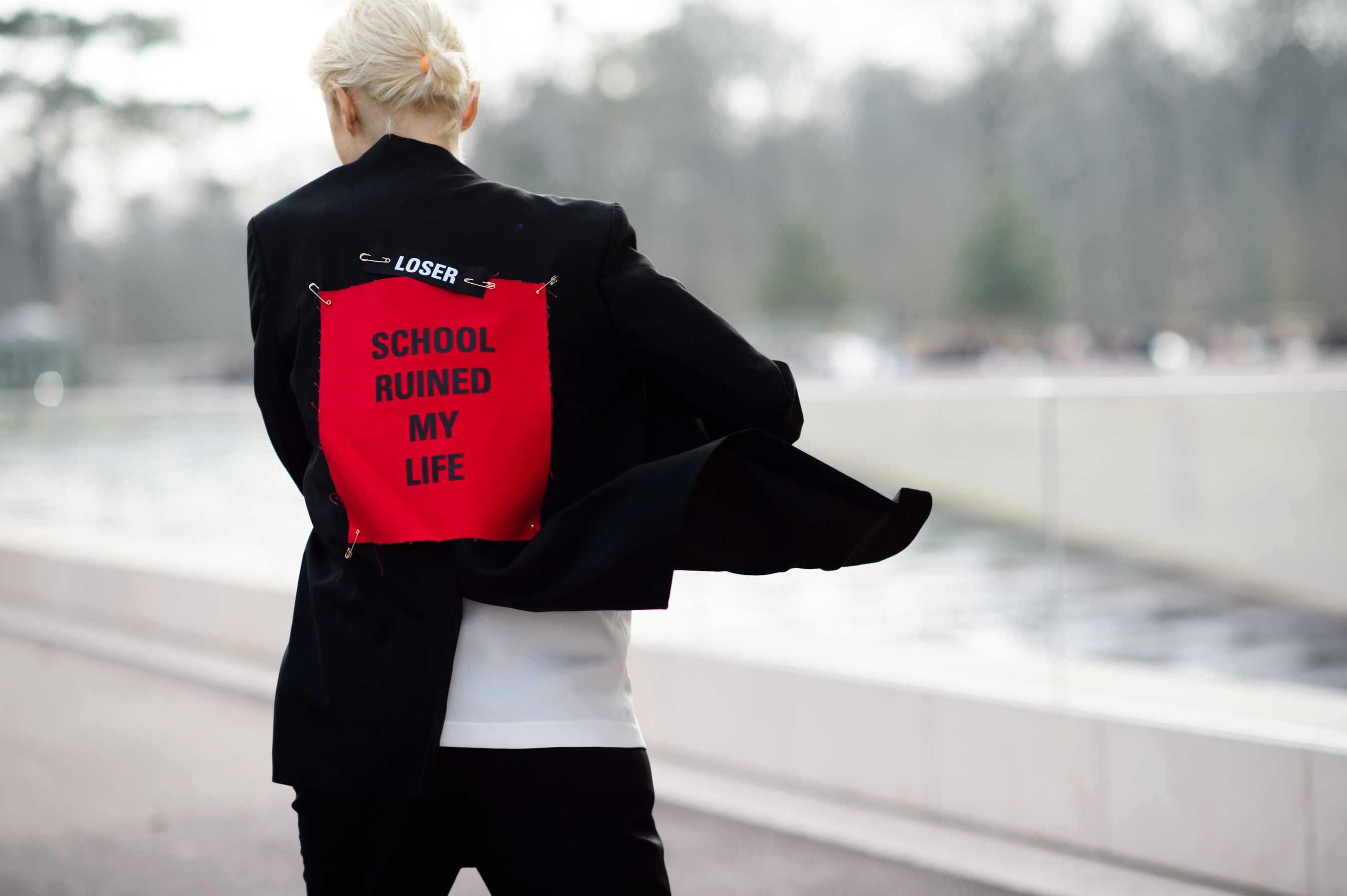 Russian girl wearing a "School Ruined My Life" jacket
