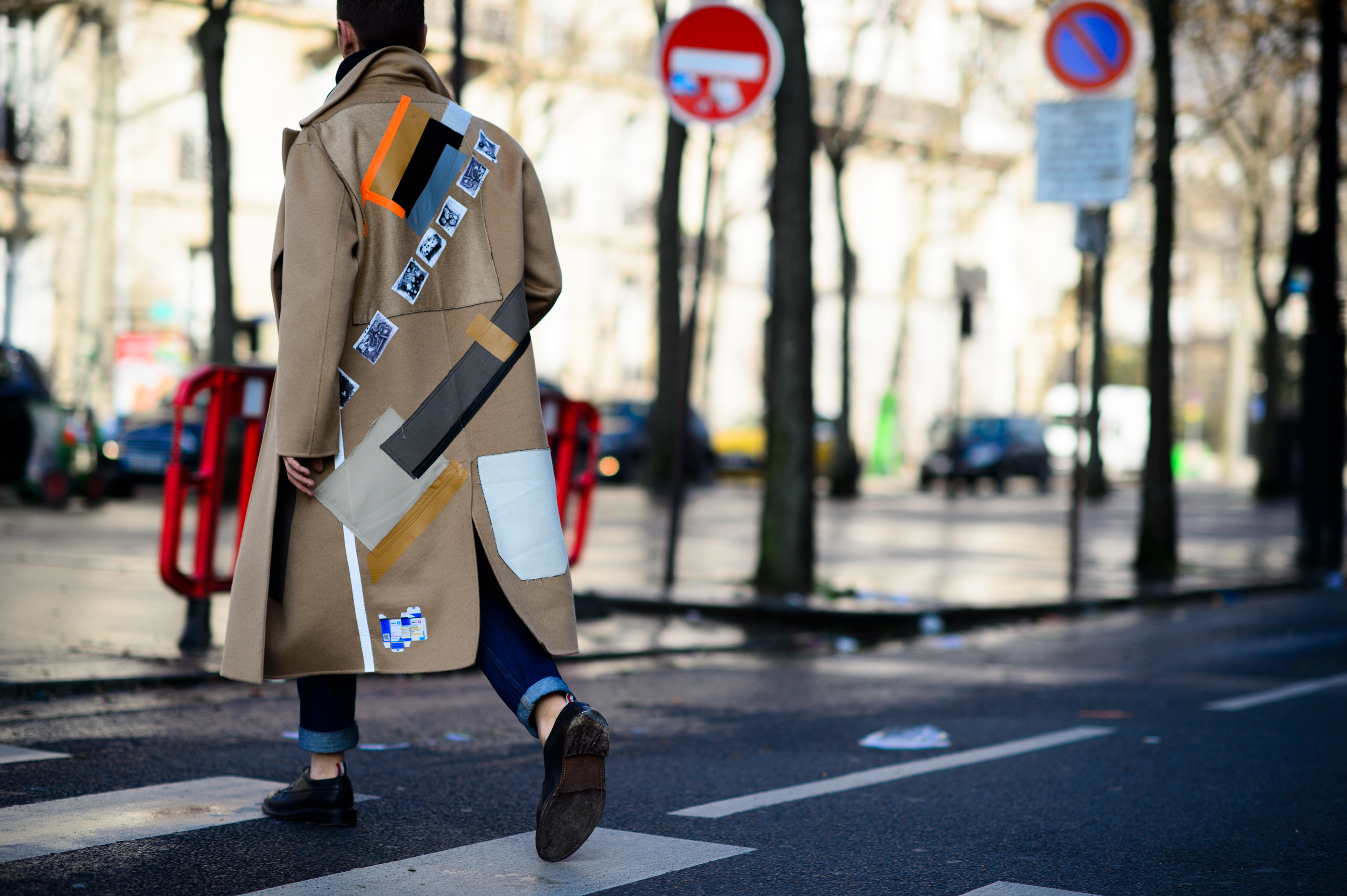 Man wearing a runway sample Raf Simons x Sterling Ruby coat