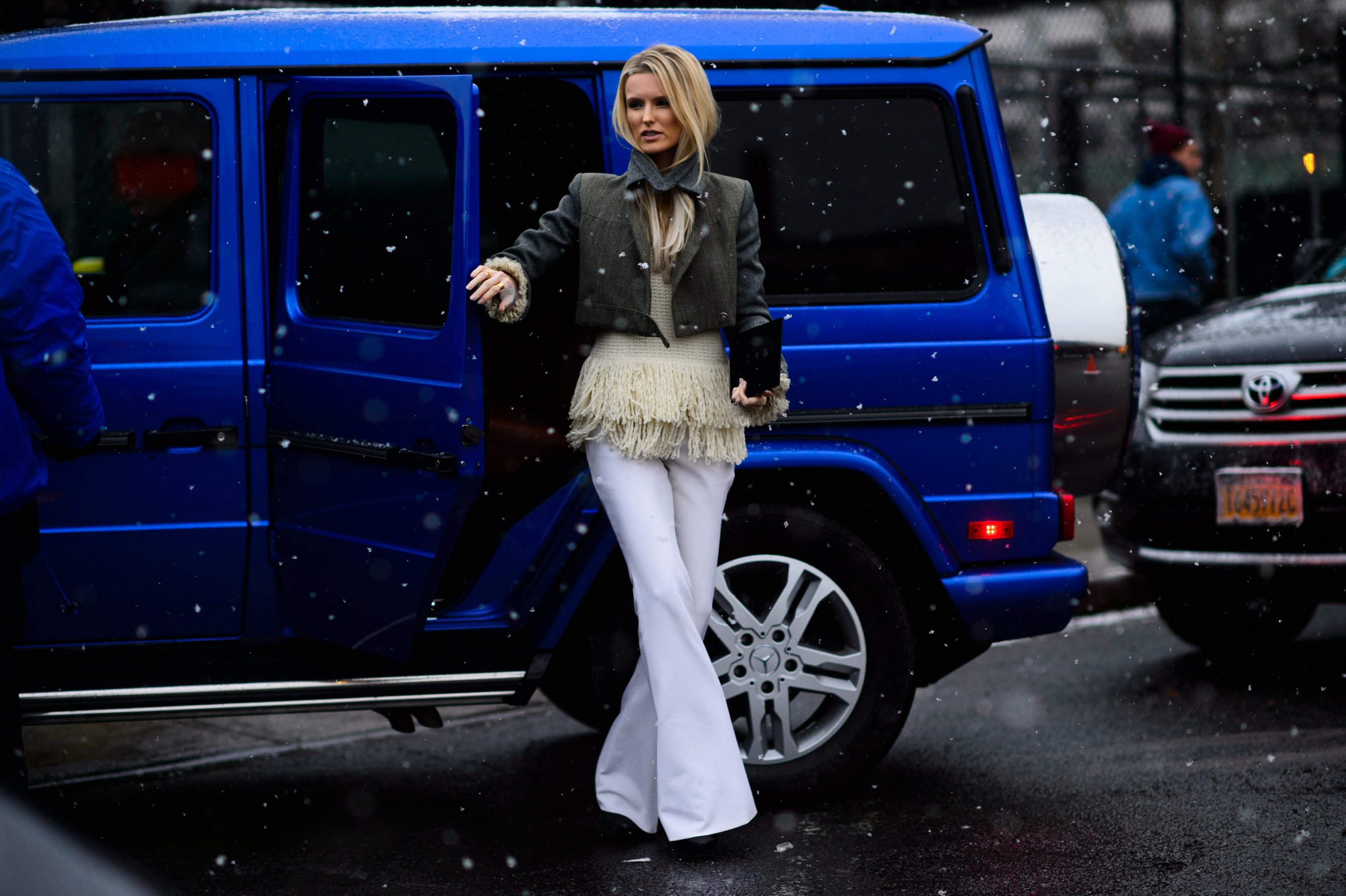 Editor in front of her blue G wagon Mercedes