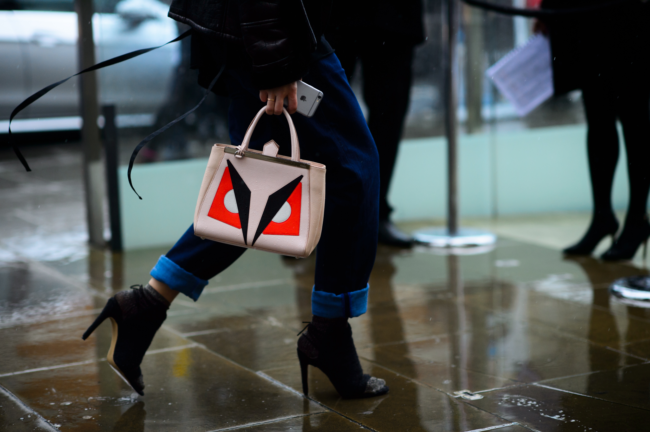 Woman with a Fendi face bag
