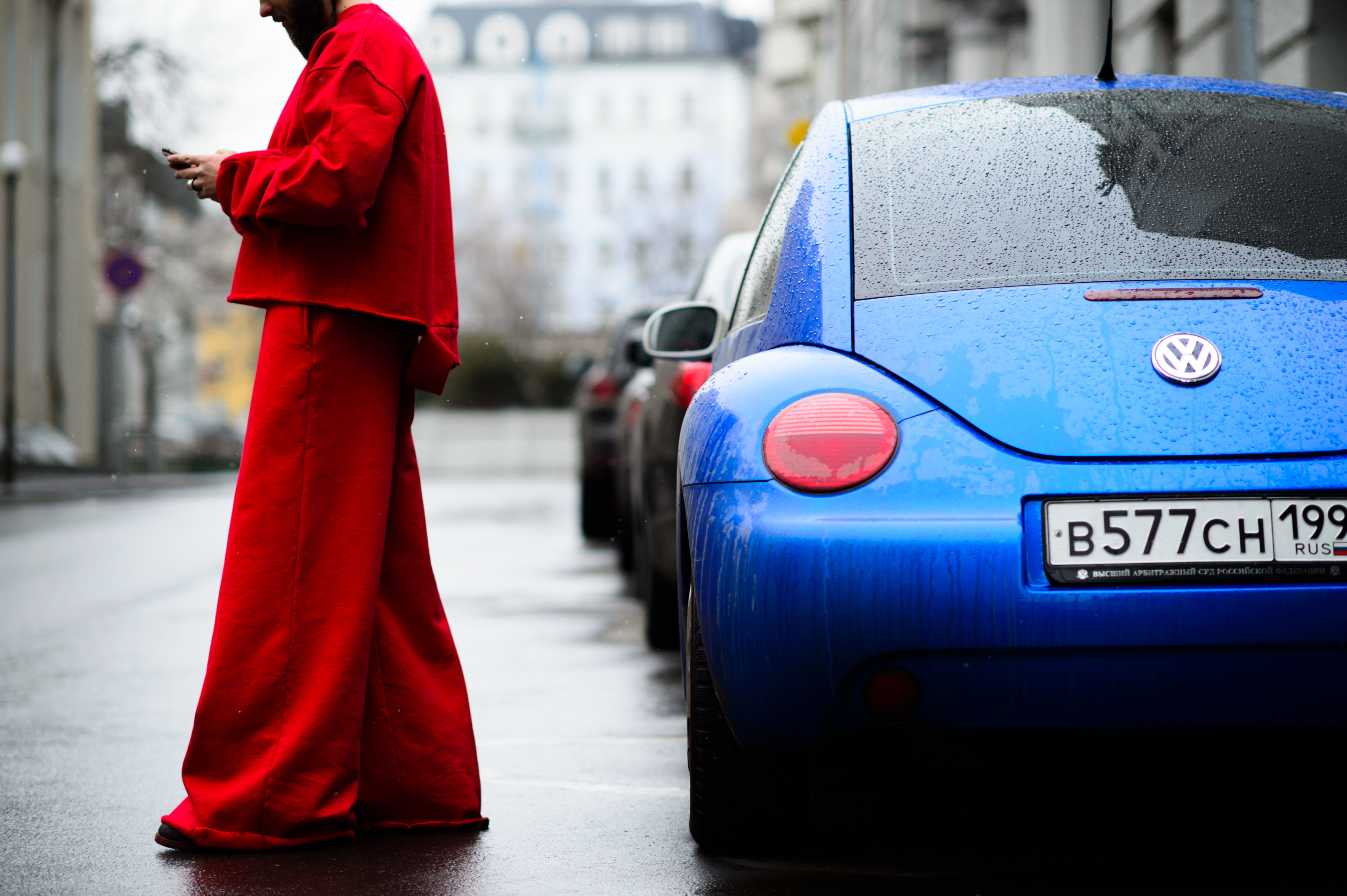 Russian man wearing bright red Vetements outfit at SVMoscow
