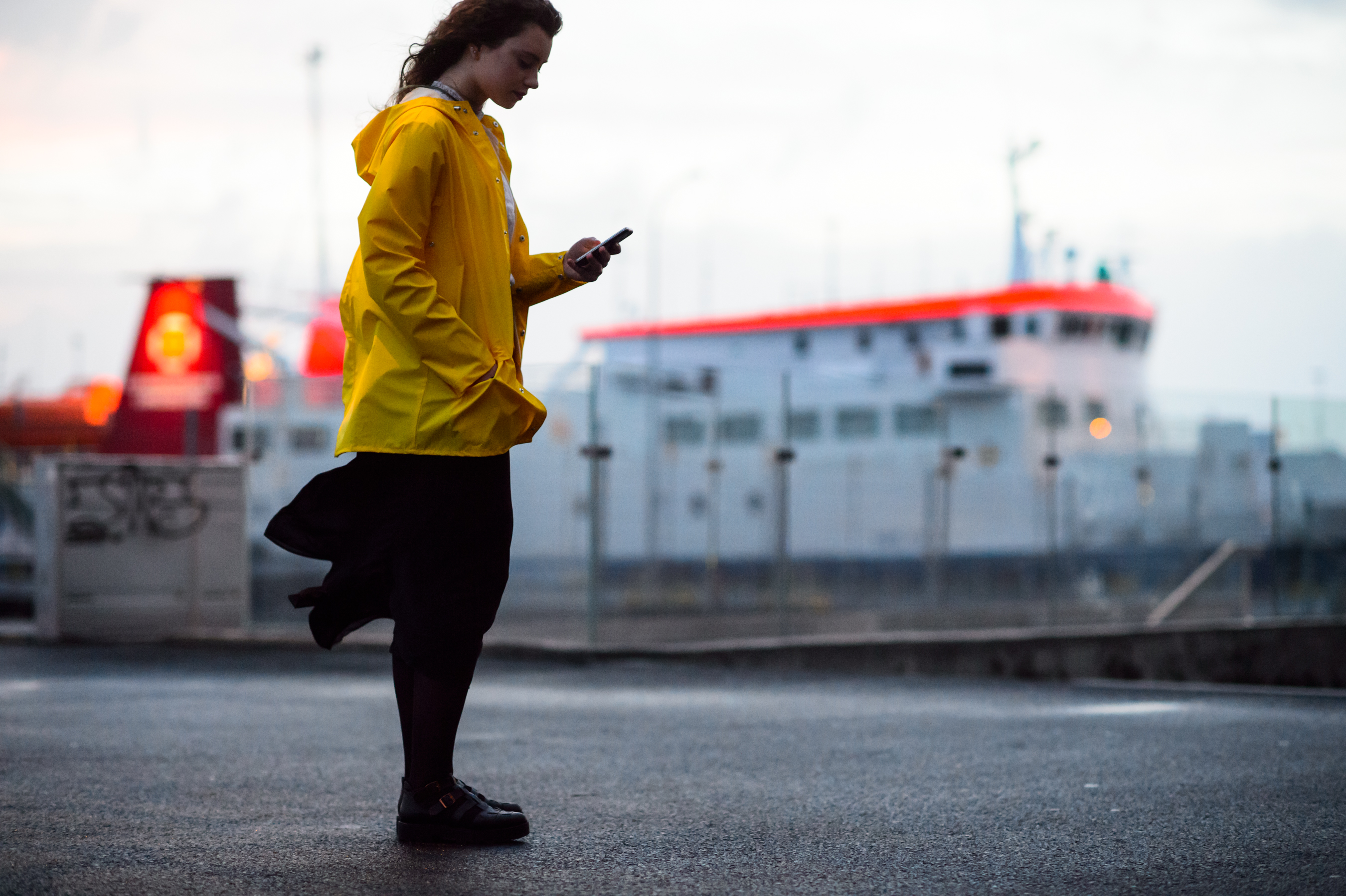 Woman wearing yellow rain coat