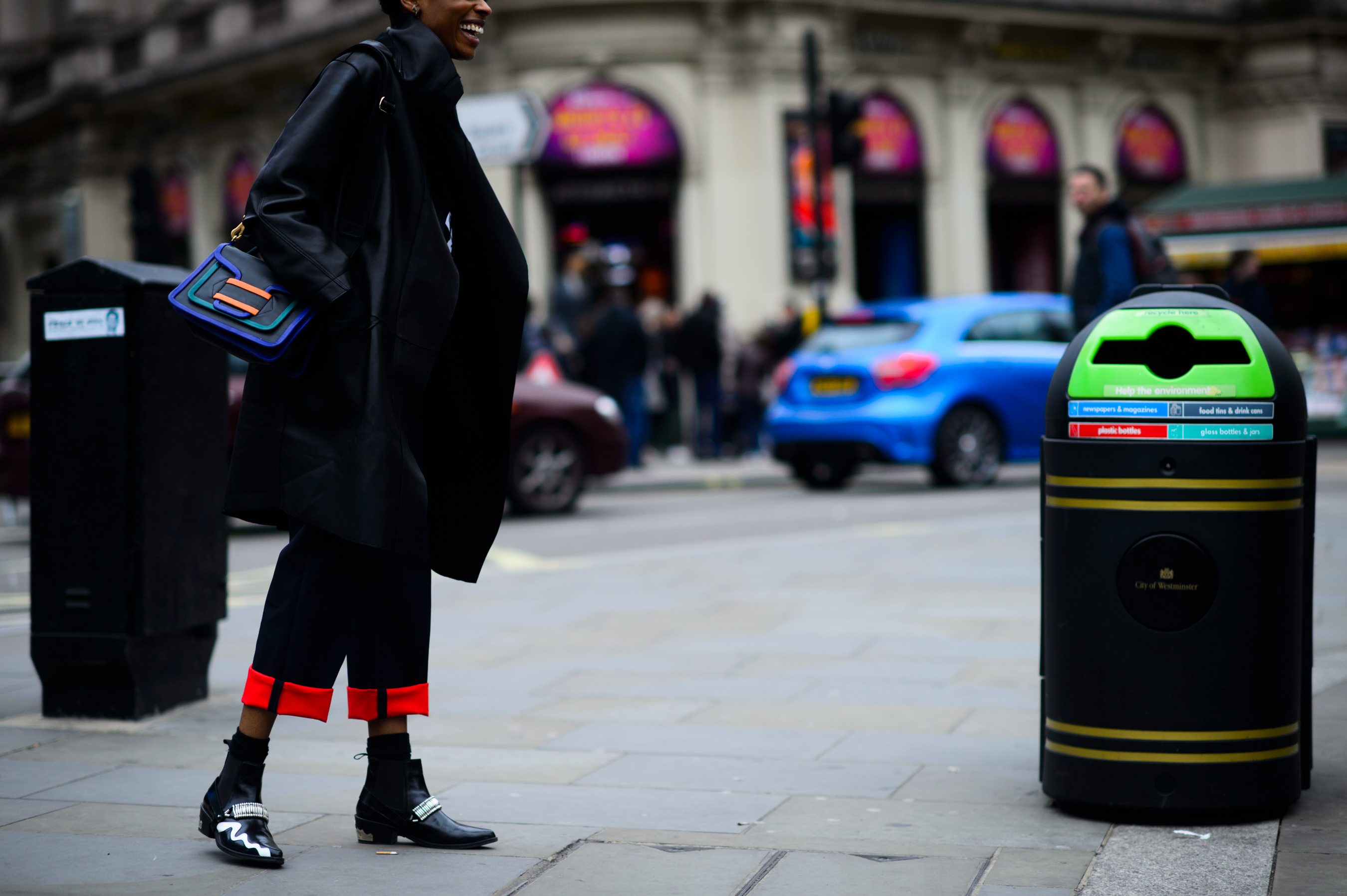 Editor in Piccadilly Circus wearing all black