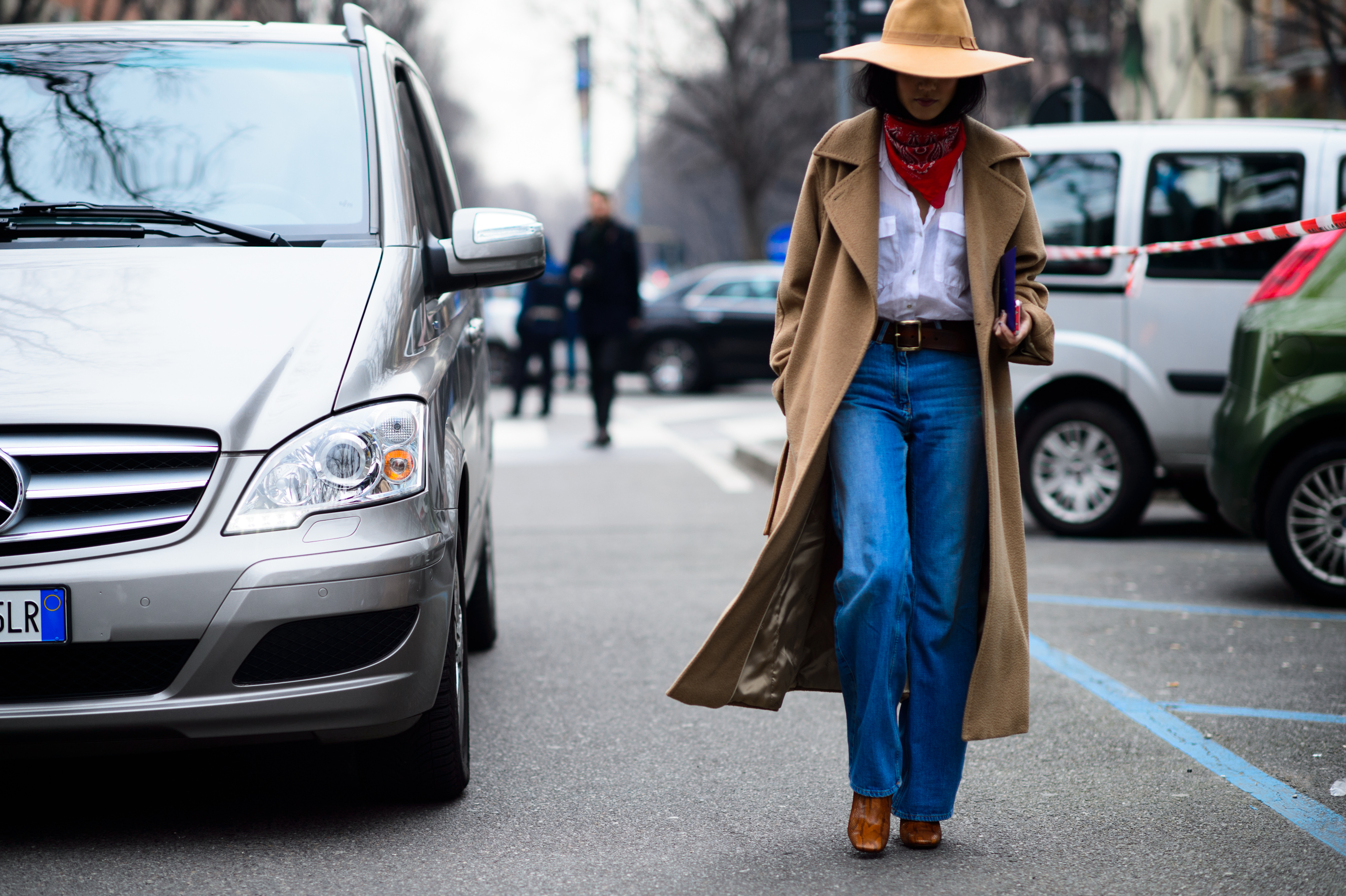 Singaporean woman wearing a camel coat