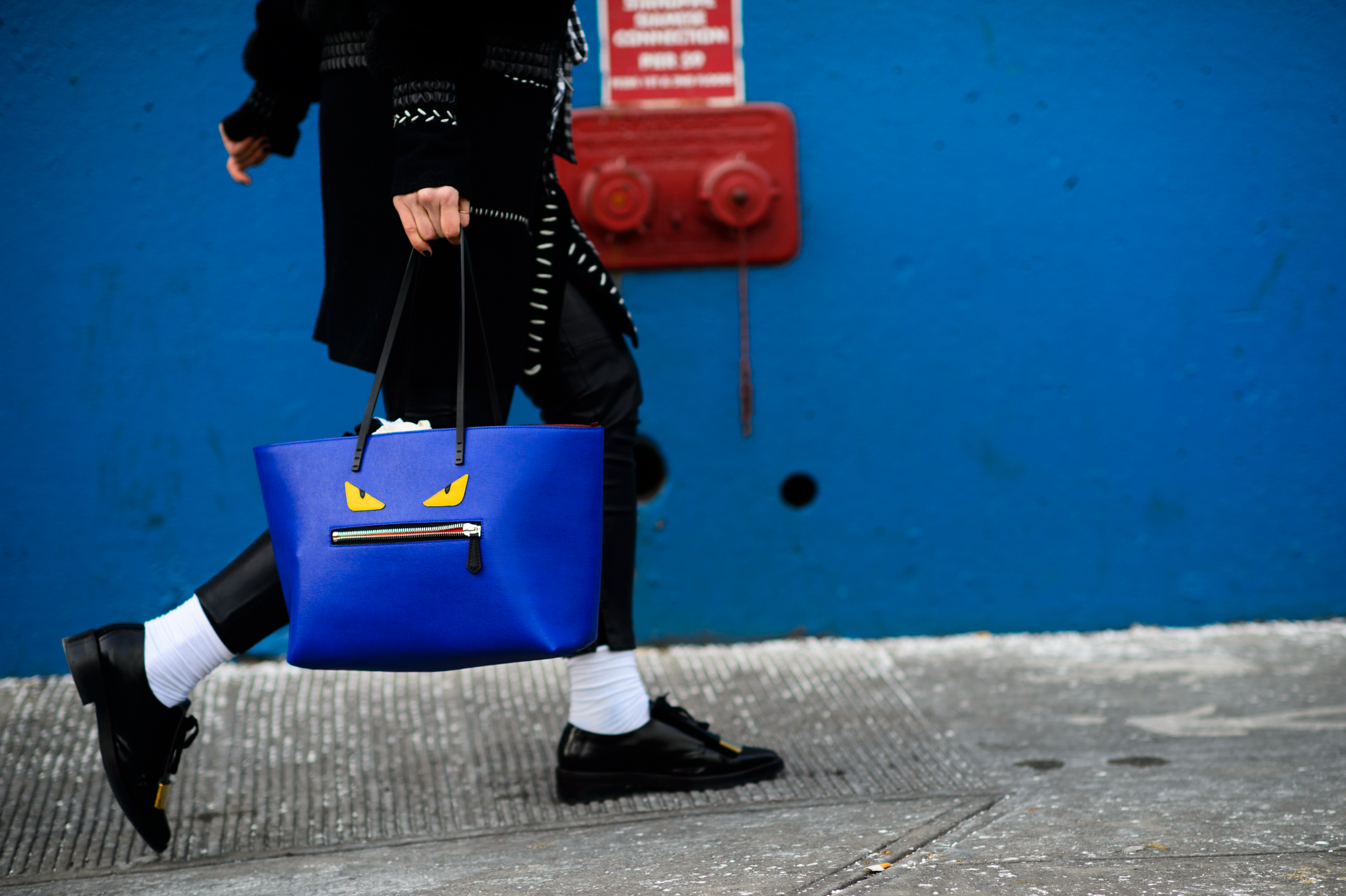 Girl with a Fendi face bag and Marni shoes