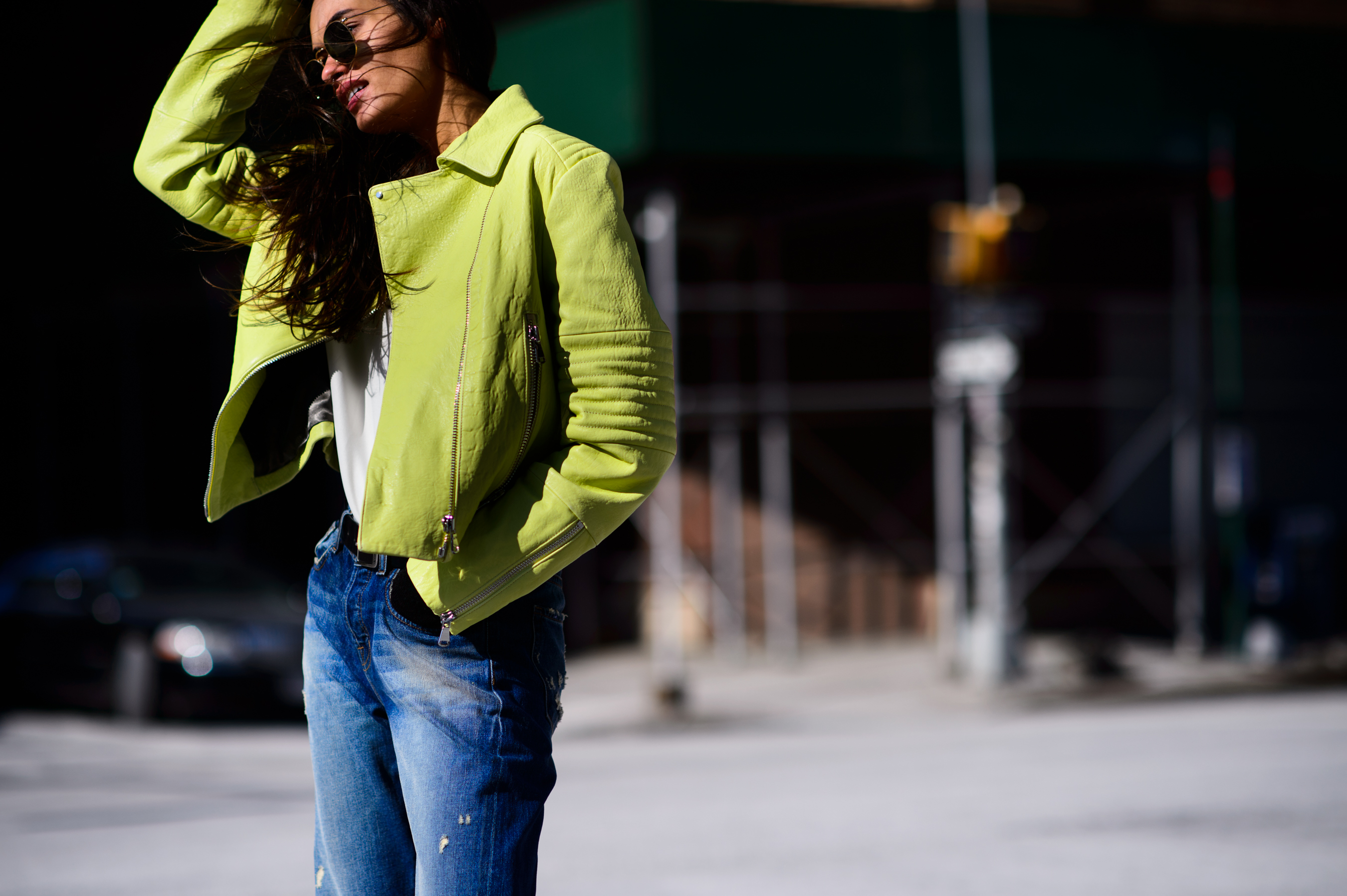 Brazilian model wearing a green leather jacket