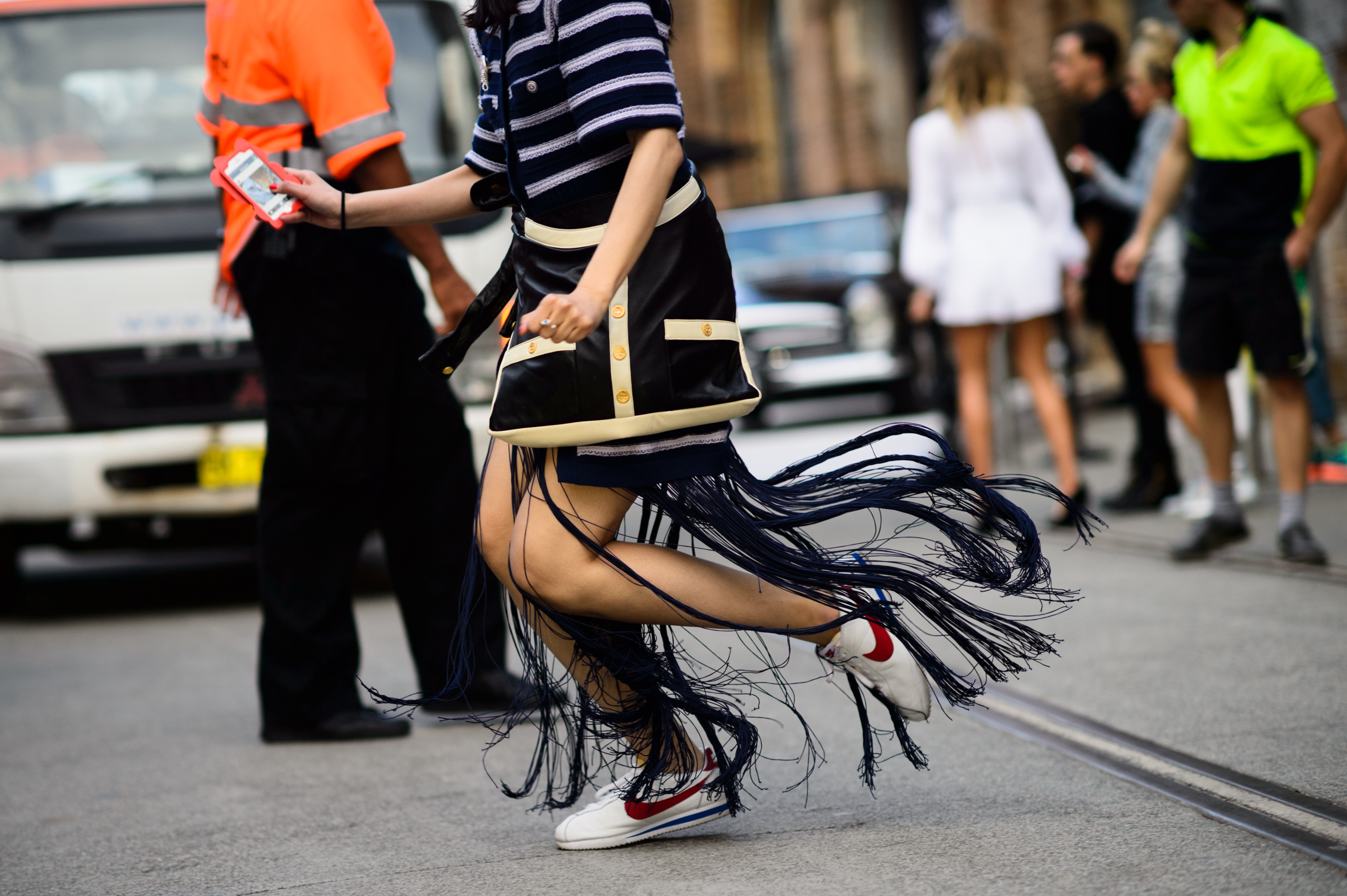 Woman running in a fringe skirt