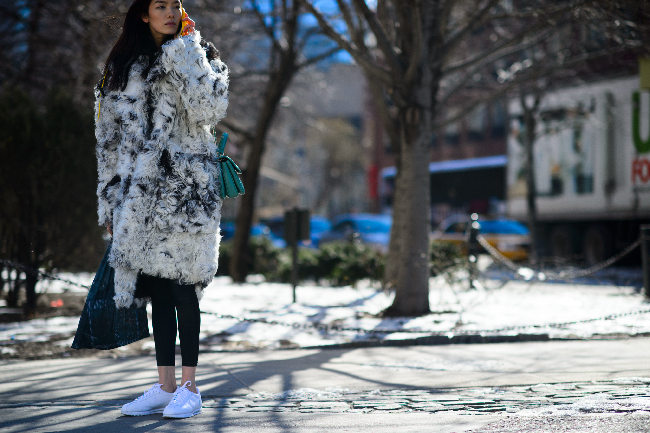 Chinese model wearing a white fur coat