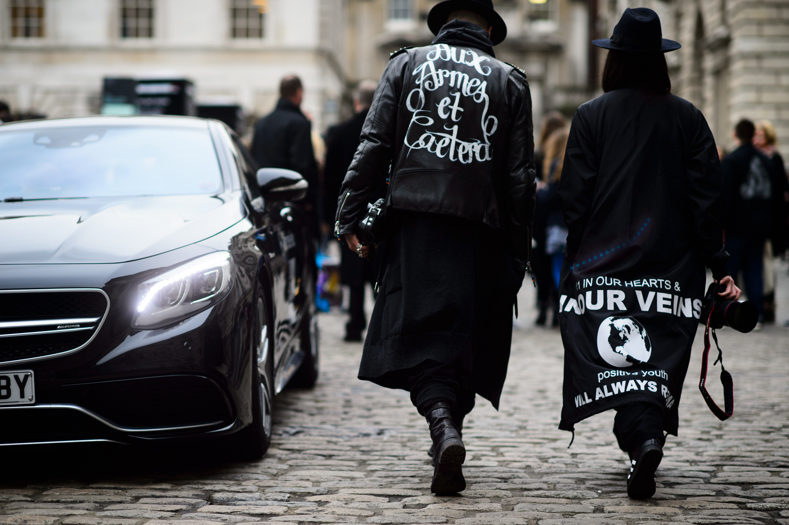 French and Spanish photographers wearing all black