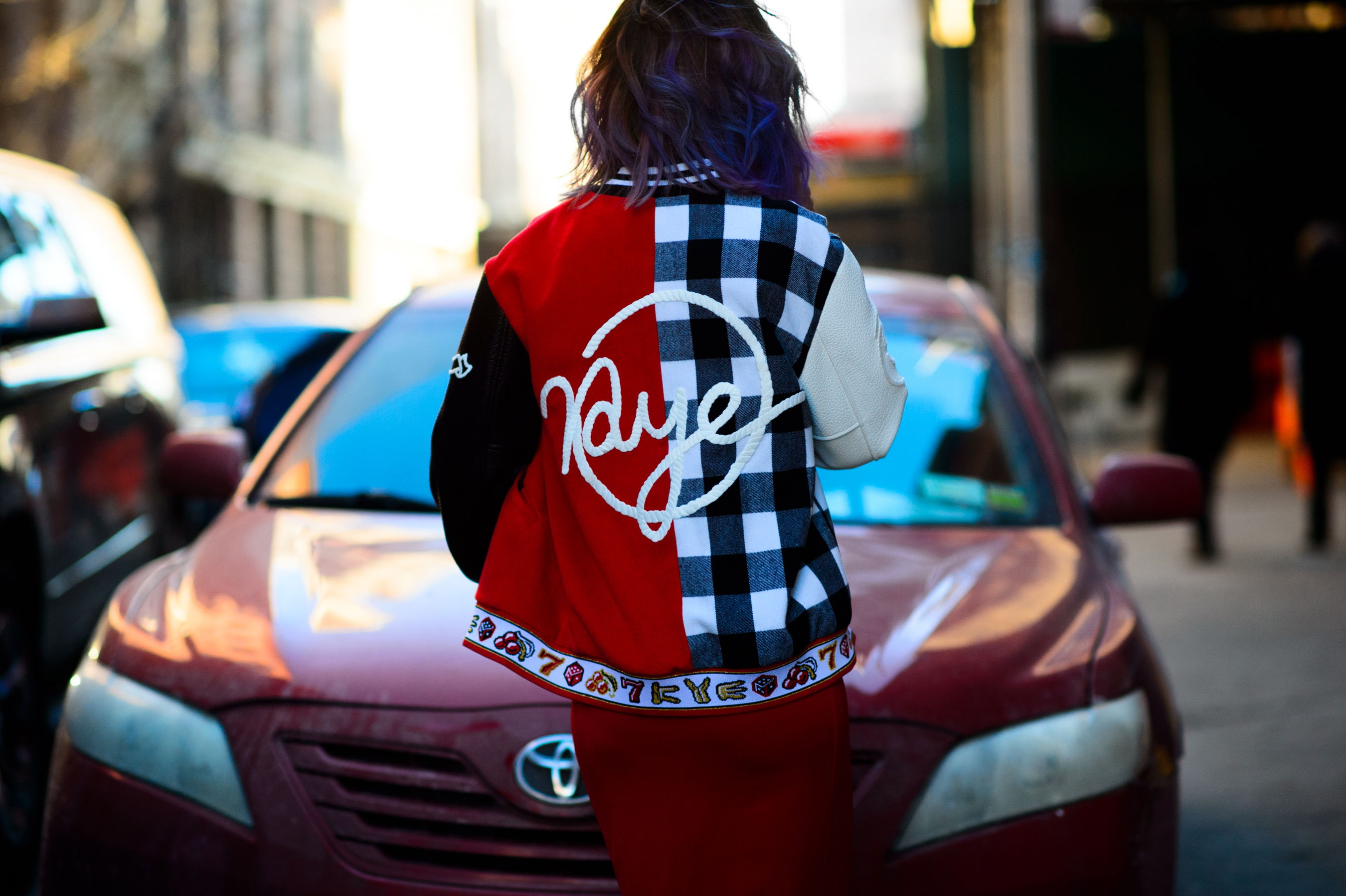 South Korean model wearing a red jacket