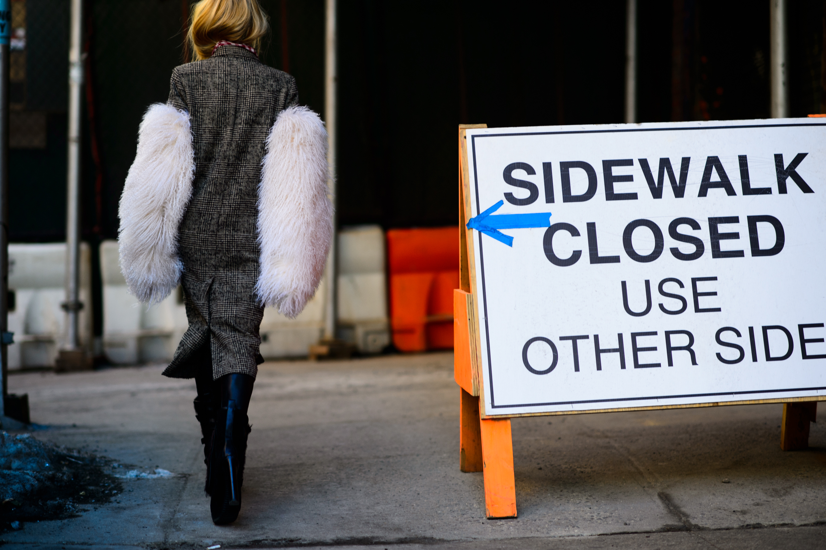 Girl wearing white fur sleeves