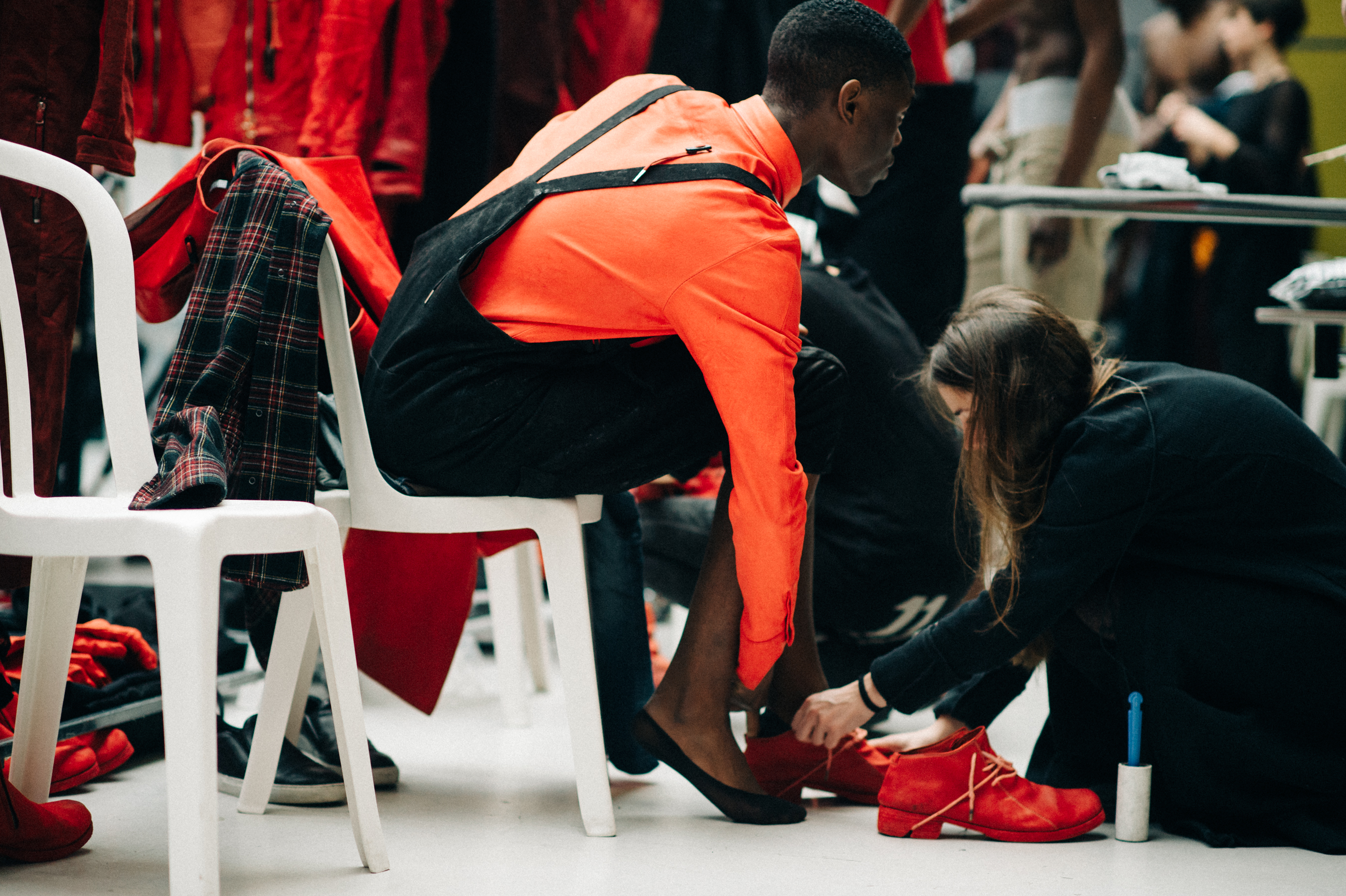 Male model Mac Phiri getting dressed