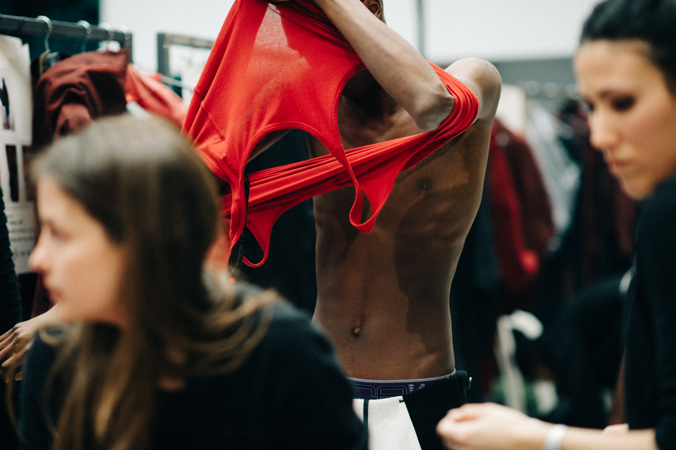Male model getting dressed