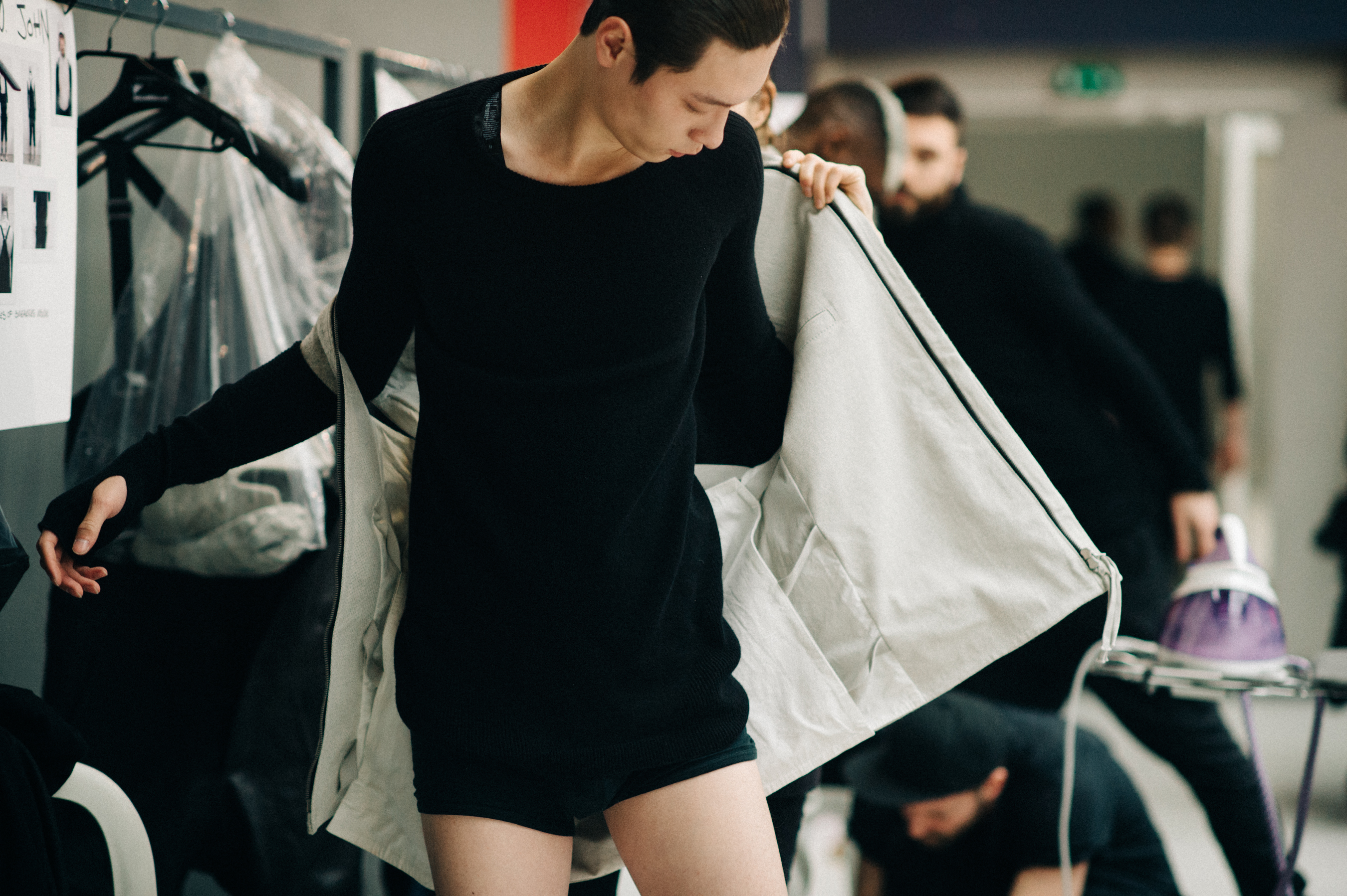 Asian male model getting dressed