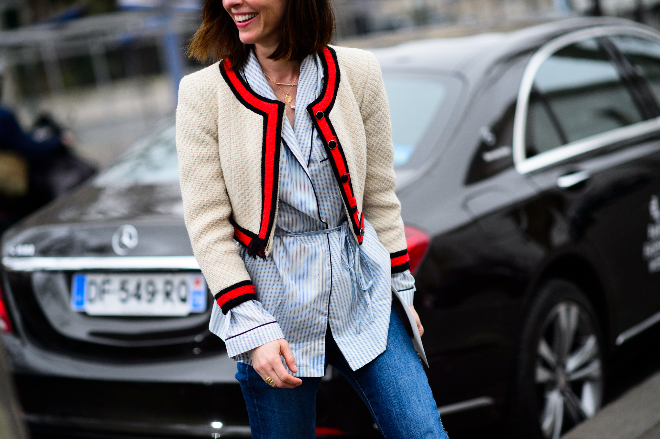Woman wearing a white wool bolero jacket