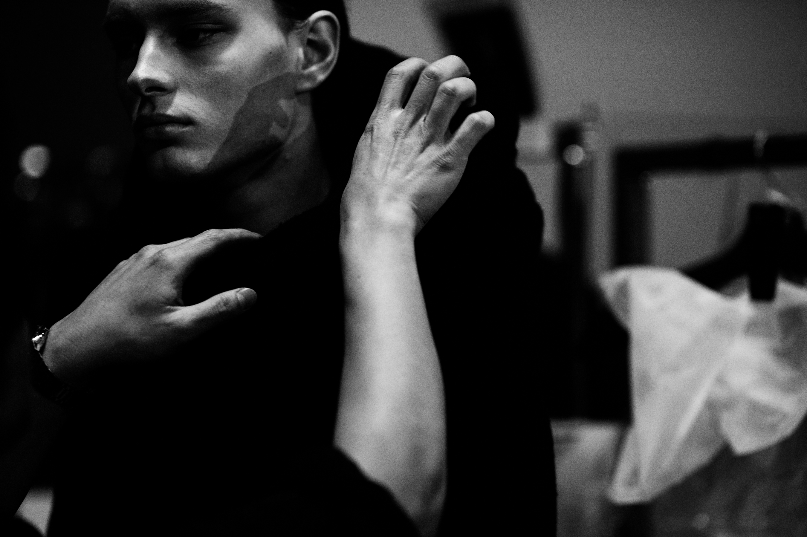 Male model being dressed