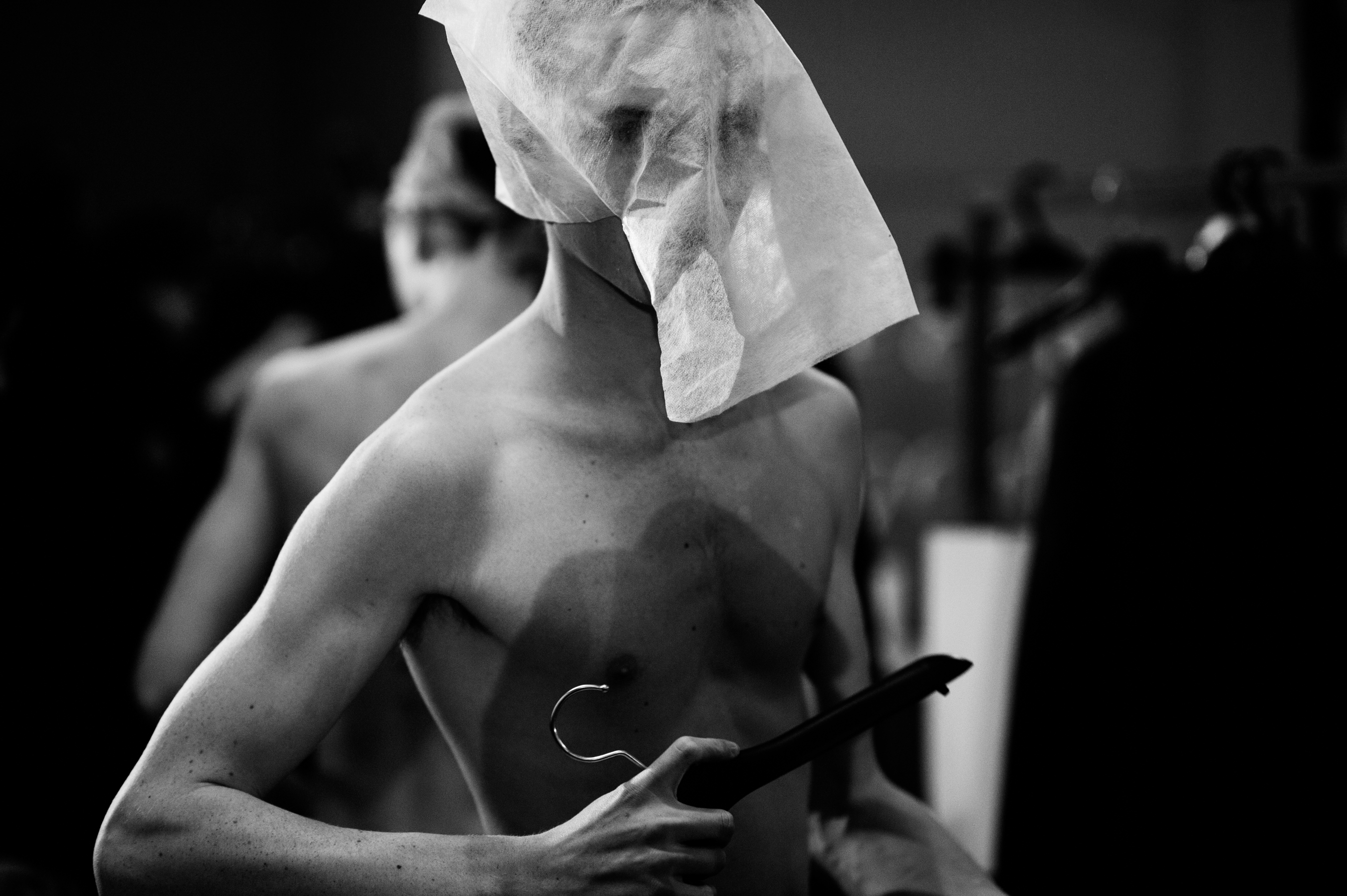 Male model with a bag on his head