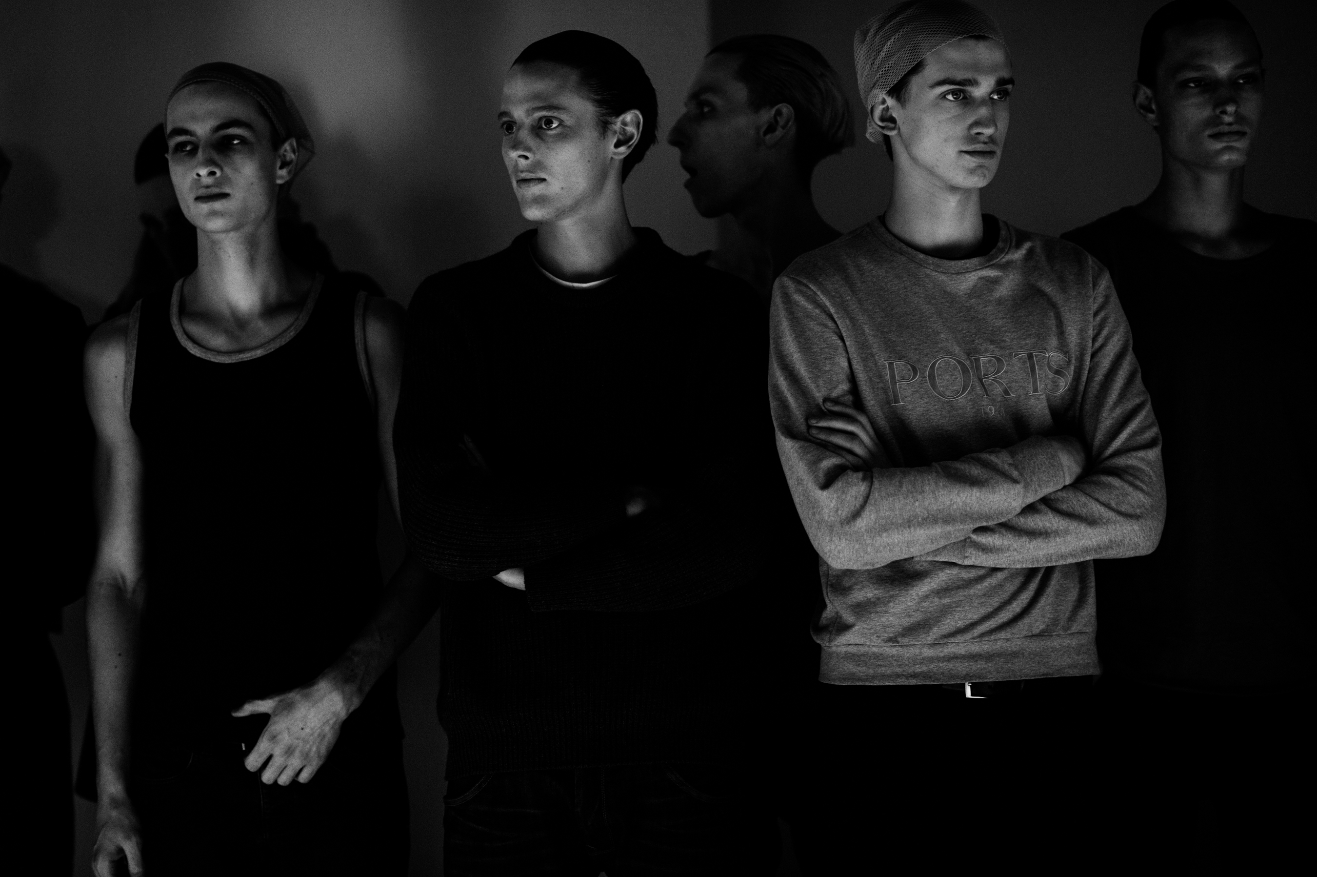 Male models before a fashion show