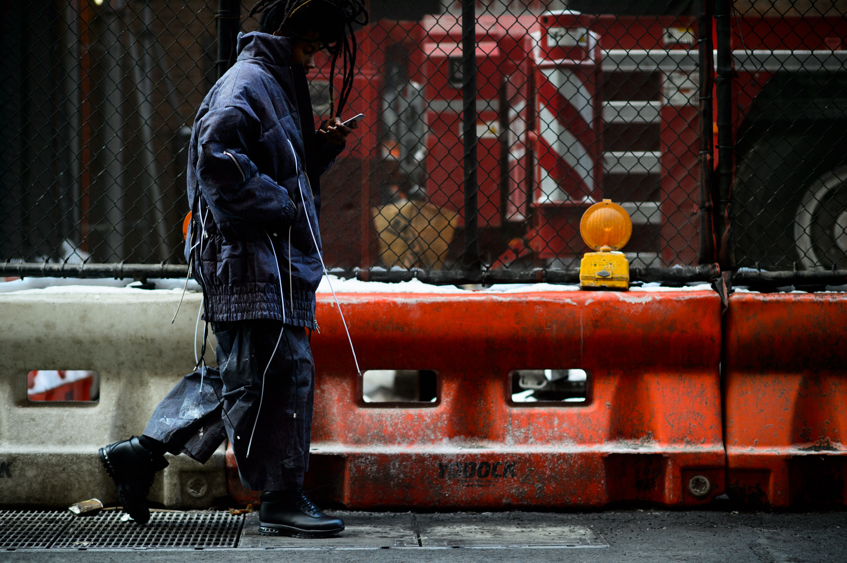 Man with dreadlocks walking in NYC
