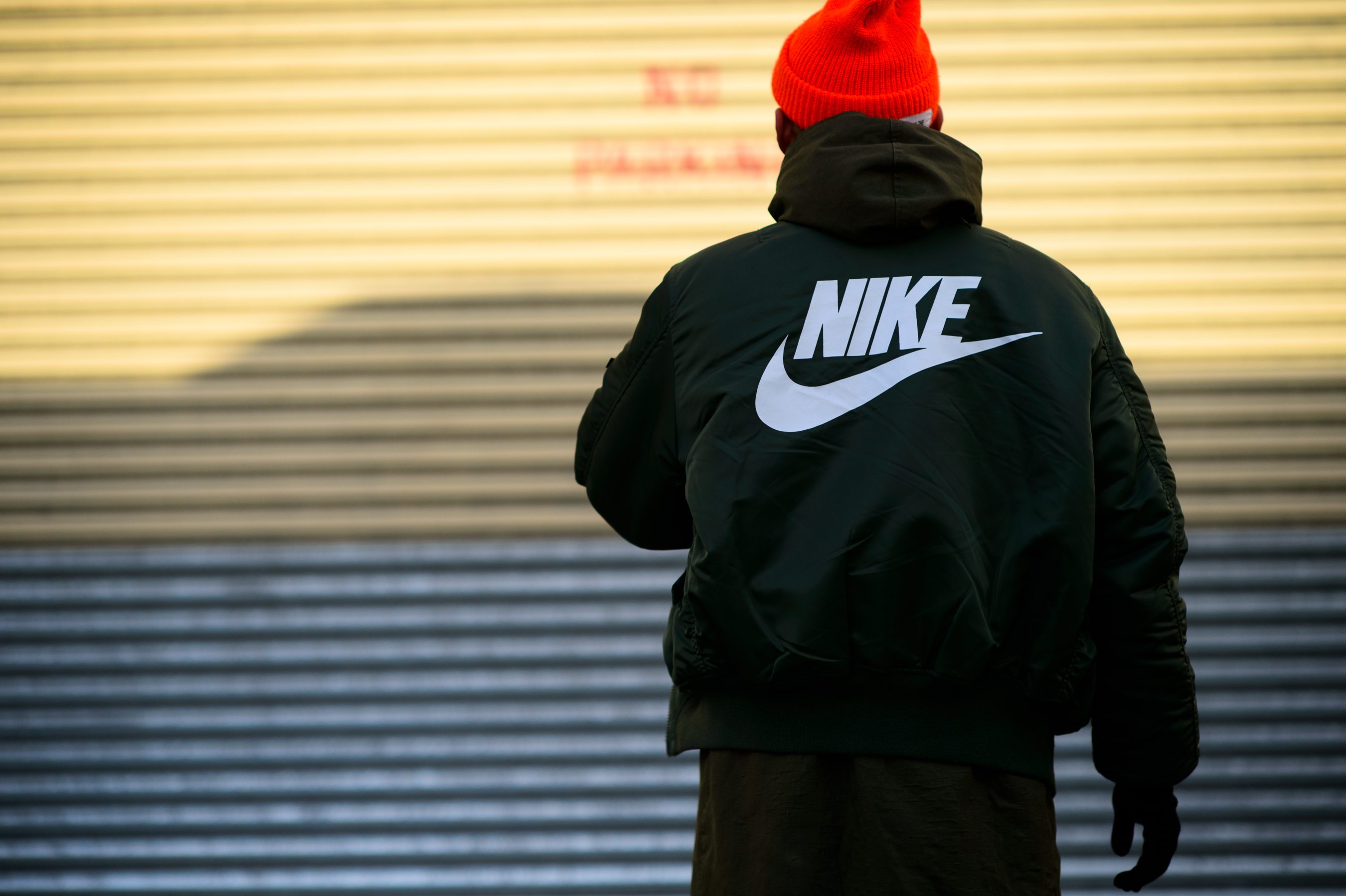 South Korean photographer wearing a fake Nike bomber
