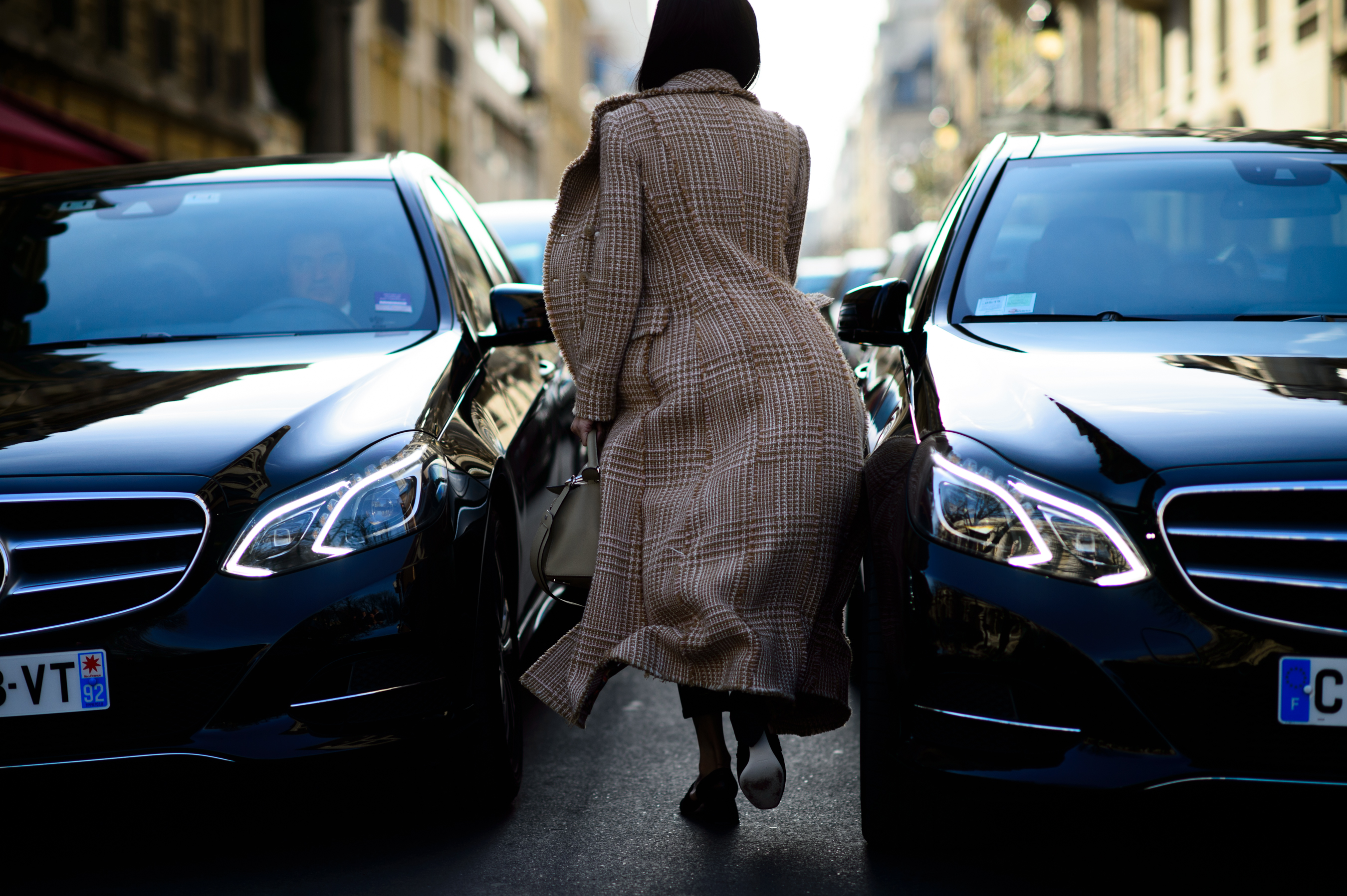 Italian blogger running in a wool coat