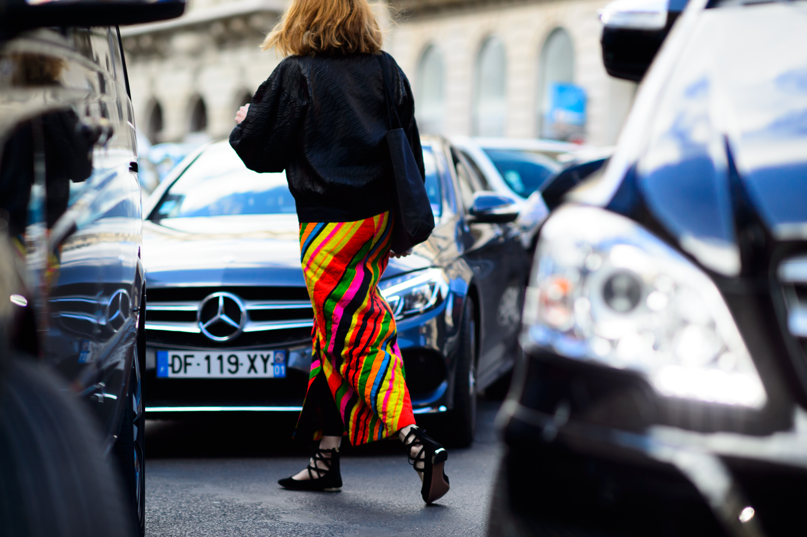American woman wearing a colorful skirt