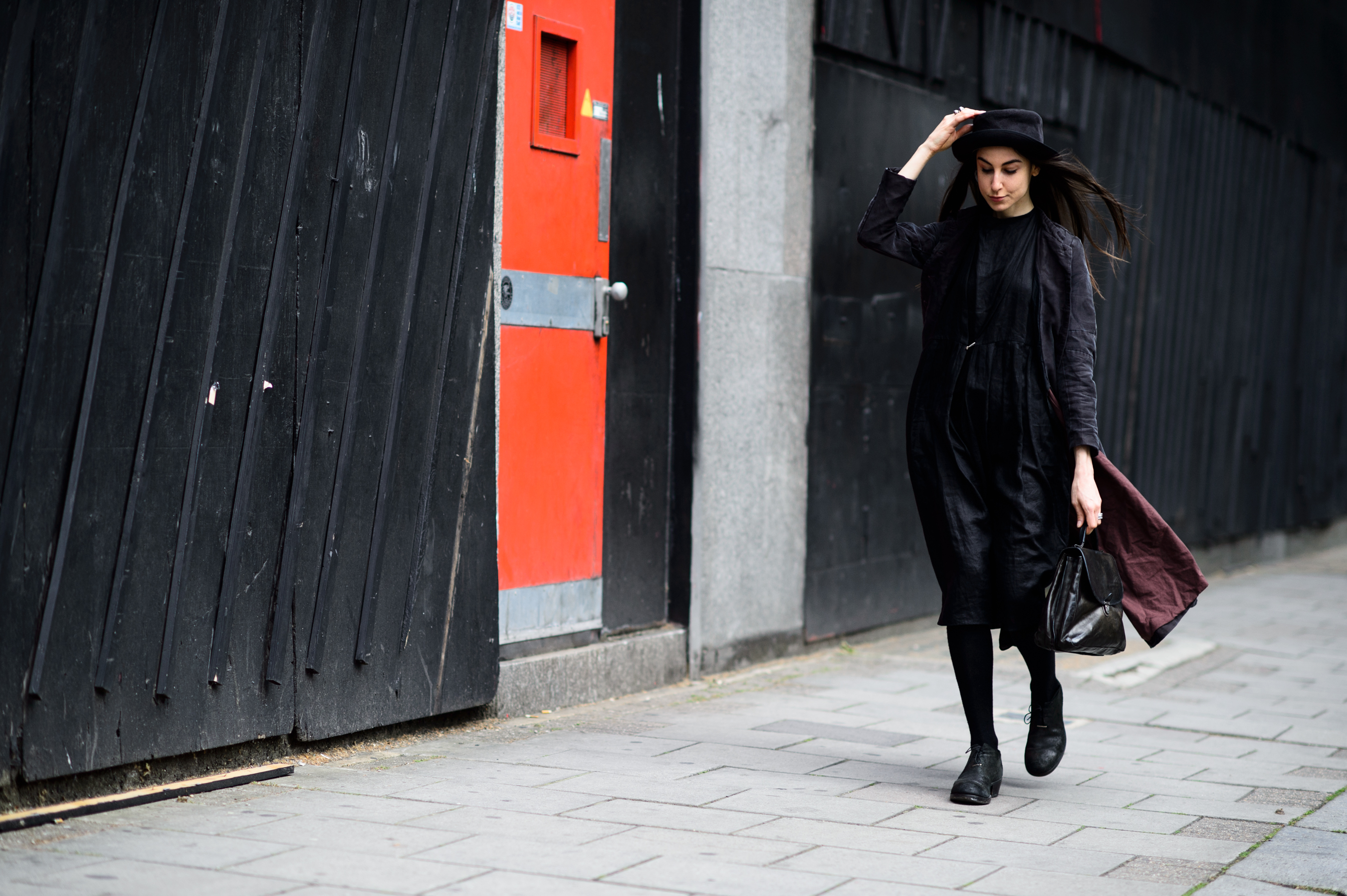 Italian girl wearing a black dress