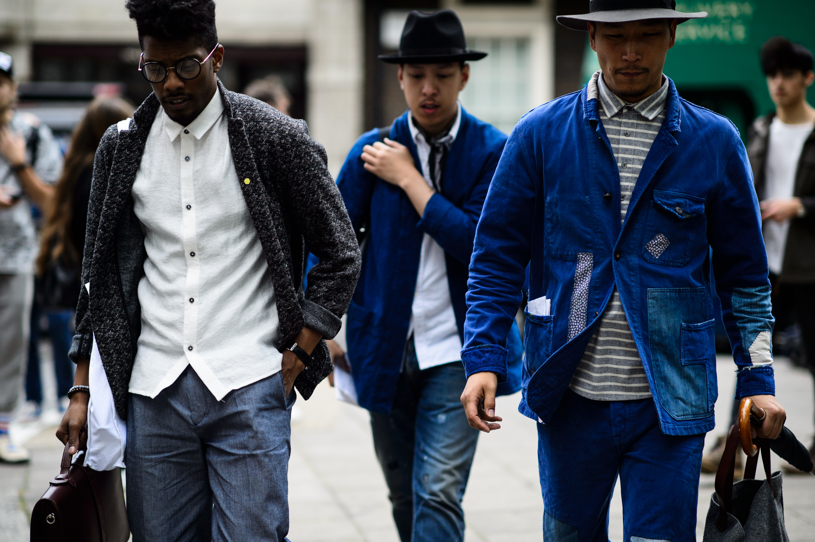 Three men leaving a fashion show