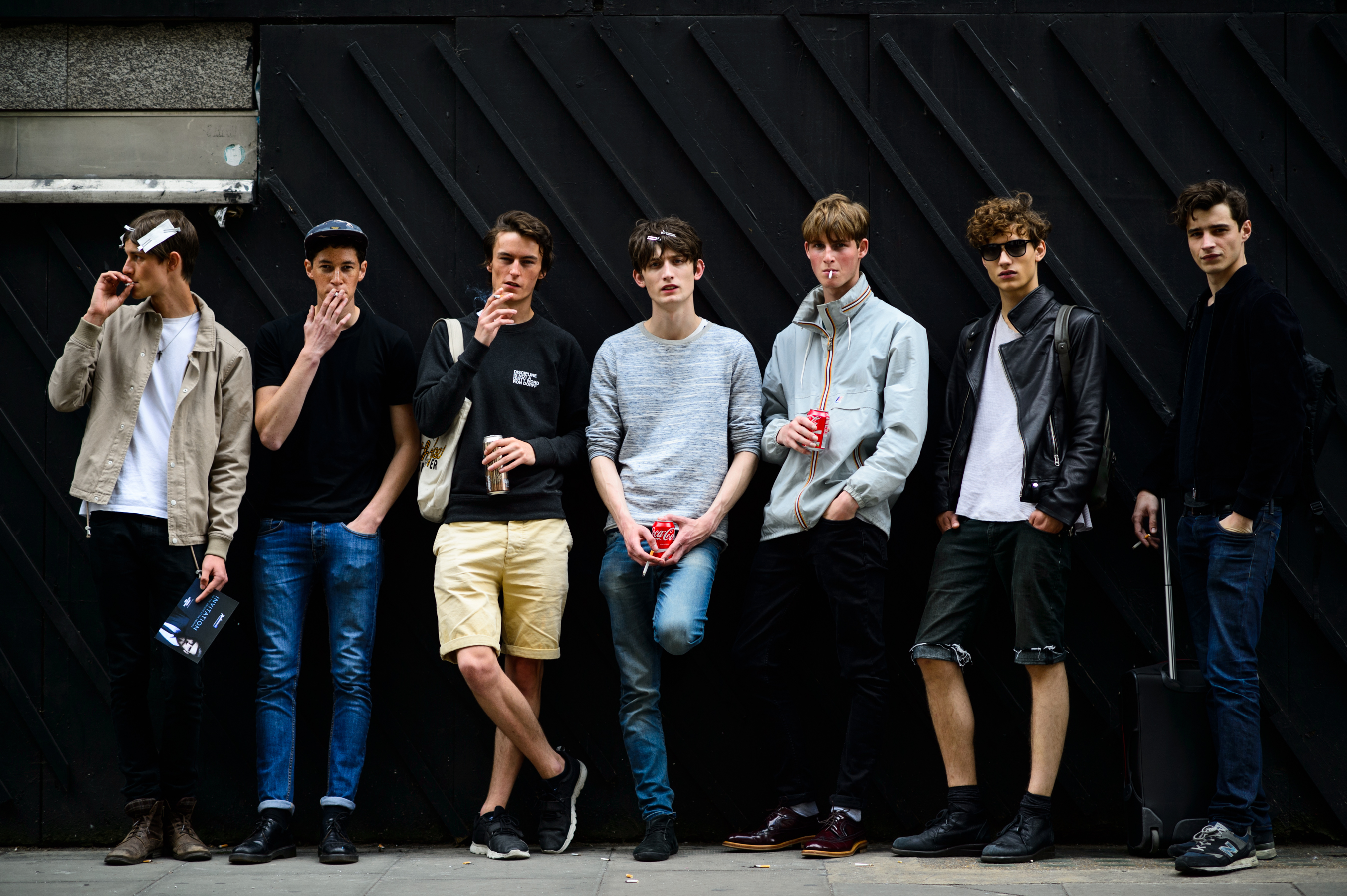 Male models outside a fashion show