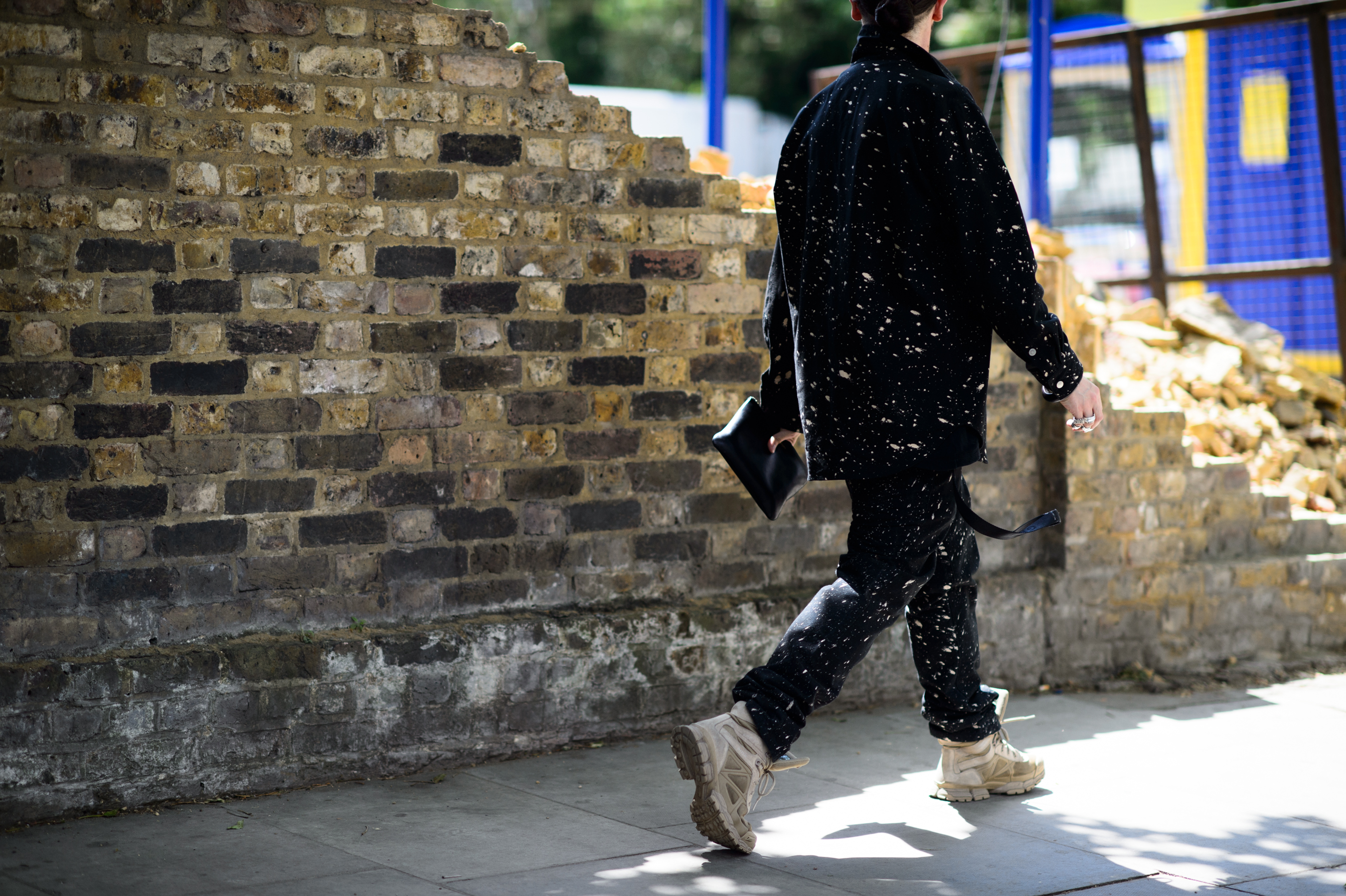 Man wearing Raf Simons x Sterling Ruby